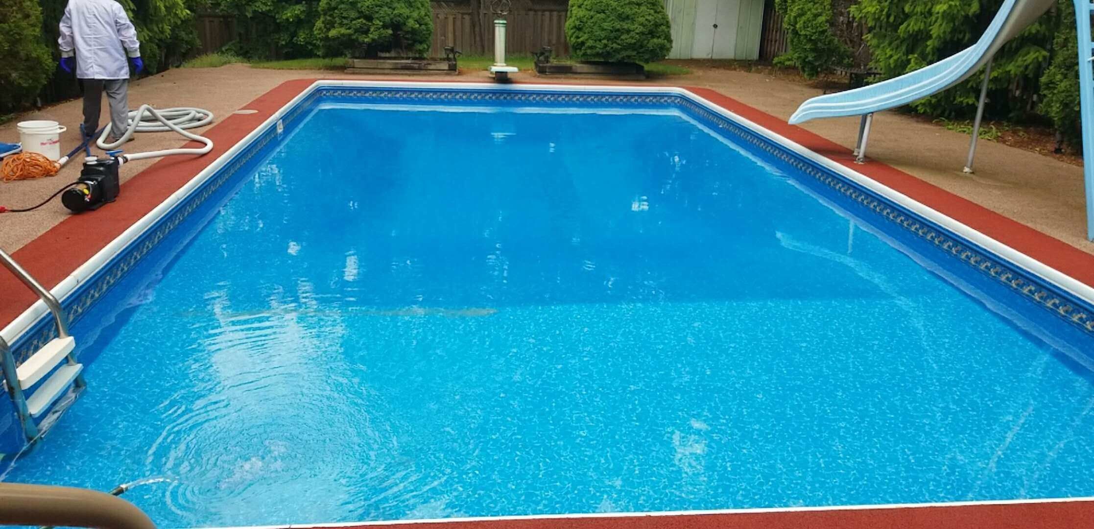After renovation photo of a fully restored backyard swimming pool in Toronto. The new bright blue liner, clean water, and resurfaced edges highlight the professional pool transformation from old and damaged to modern and inviting. Expert pool renovation by local Toronto specialists.