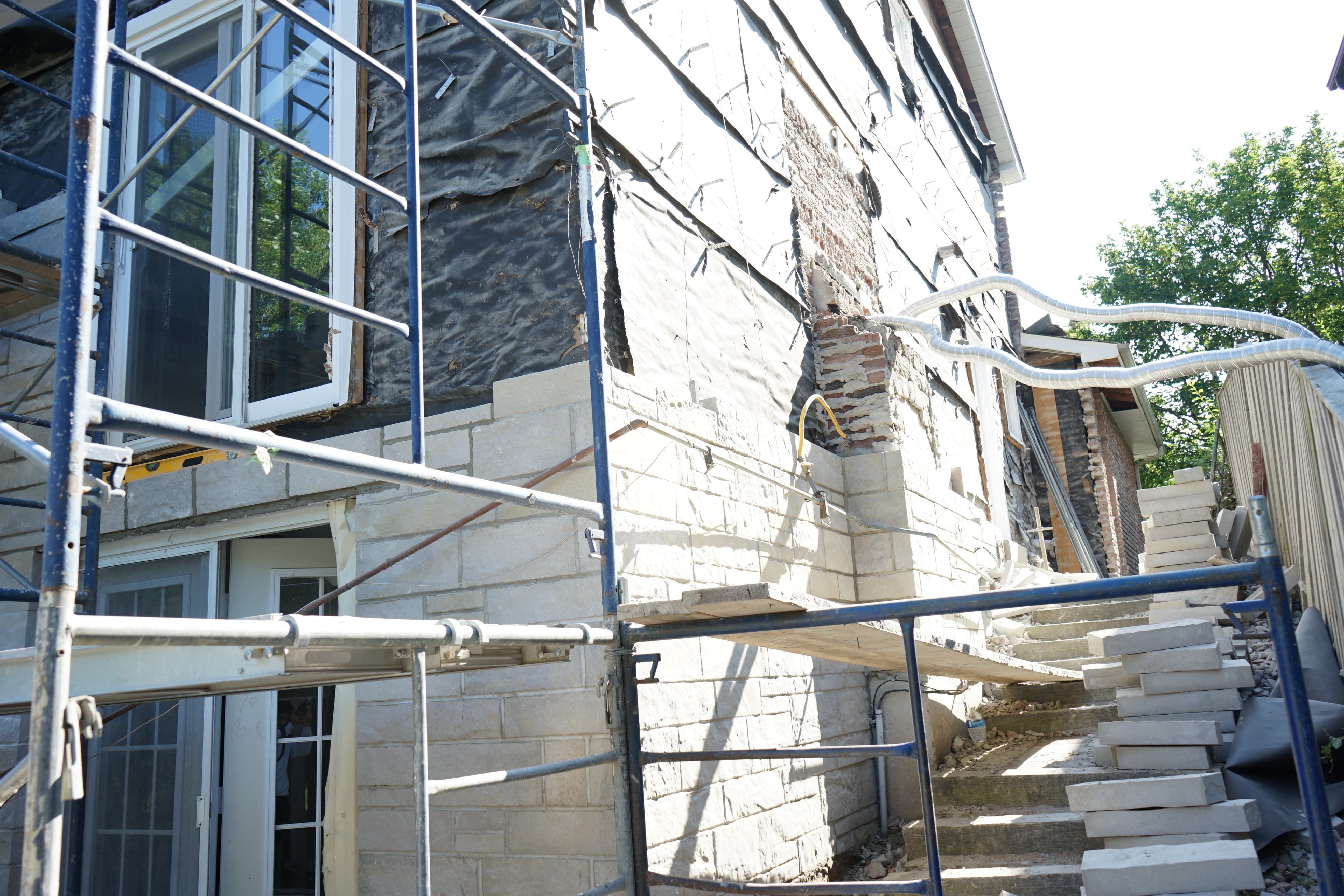 Professional exterior wall remodeling project in Richmond Hill showcasing a refreshed brick façade using high-quality finishes.