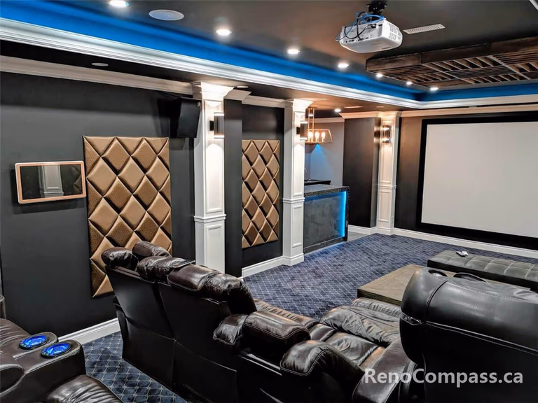 High-end home theatre installation in Mississauga featuring a large projection screen, custom ceiling lighting, built-in speakers, and luxury reclining seating. This professionally designed basement cinema combines acoustic optimization, modern lighting design, and premium finishes to create an immersive private movie theatre experience for homeowners seeking comfort and entertainment.