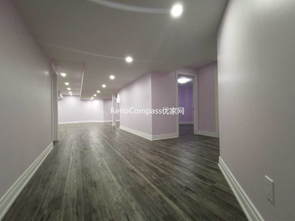 This Richmond Hill basement renovation features a spacious open-concept layout with modern recessed lighting, durable wood-look flooring, and soft neutral wall tones to create a bright and welcoming environment. Completed by a professional Toronto renovation company, the redesigned basement offers a versatile living area suitable for entertainment, rental potential, or extended family use. The clean layout and upgraded finishes enhance both functionality and overall property value.