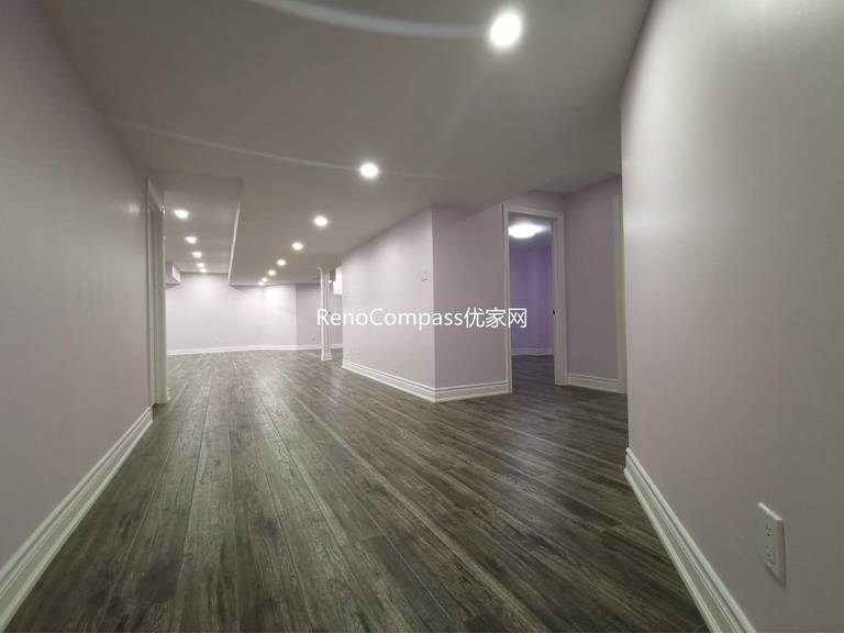 This Richmond Hill basement renovation features a spacious open-concept layout with modern recessed lighting, durable wood-look flooring, and soft neutral wall tones to create a bright and welcoming environment. Completed by a professional Toronto renovation company, the redesigned basement offers a versatile living area suitable for entertainment, rental potential, or extended family use. The clean layout and upgraded finishes enhance both functionality and overall property value.