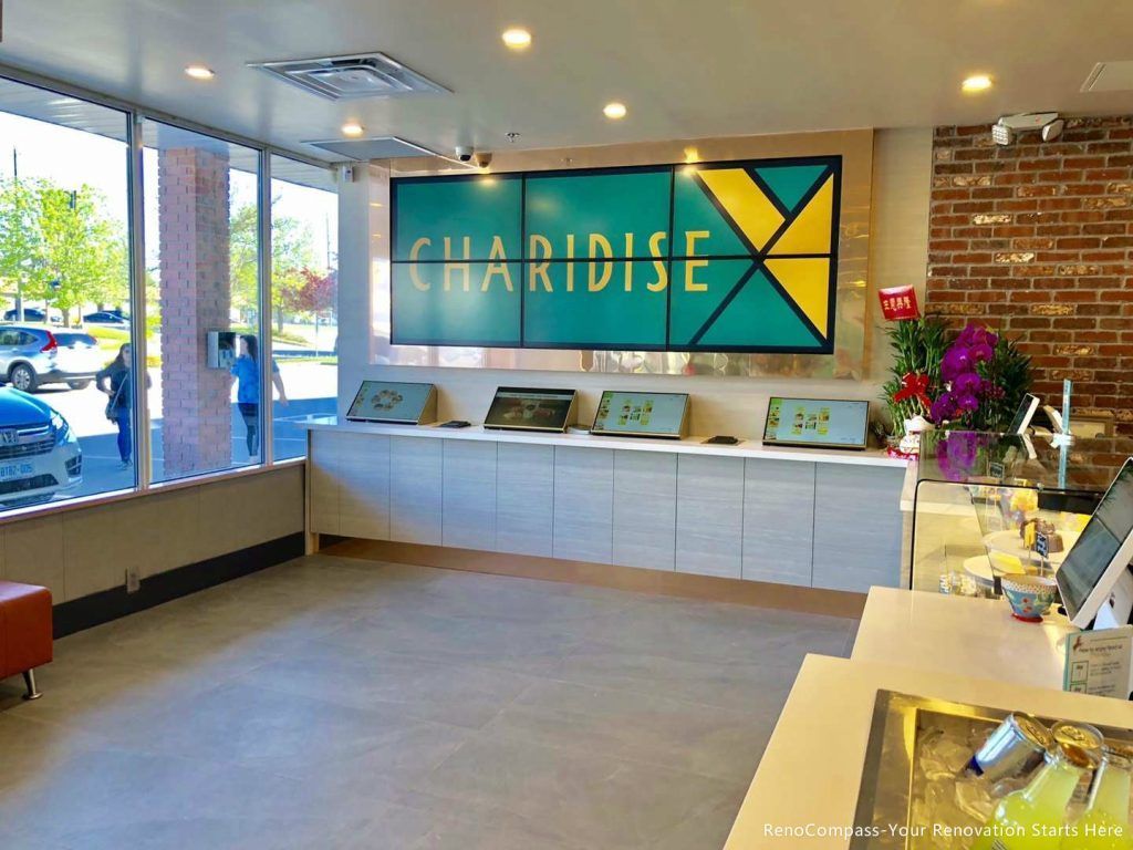This Barrie commercial renovation showcases a modern bubble tea shop front counter and custom branding wall installation. Featuring clean cabinetry, bright display counters, and large storefront windows, the space is designed to enhance customer experience and brand visibility. Completed by Reno Compass Inc., a professional Toronto renovation company, this project highlights high-quality commercial construction tailored for cafés, dessert shops, and retail businesses.