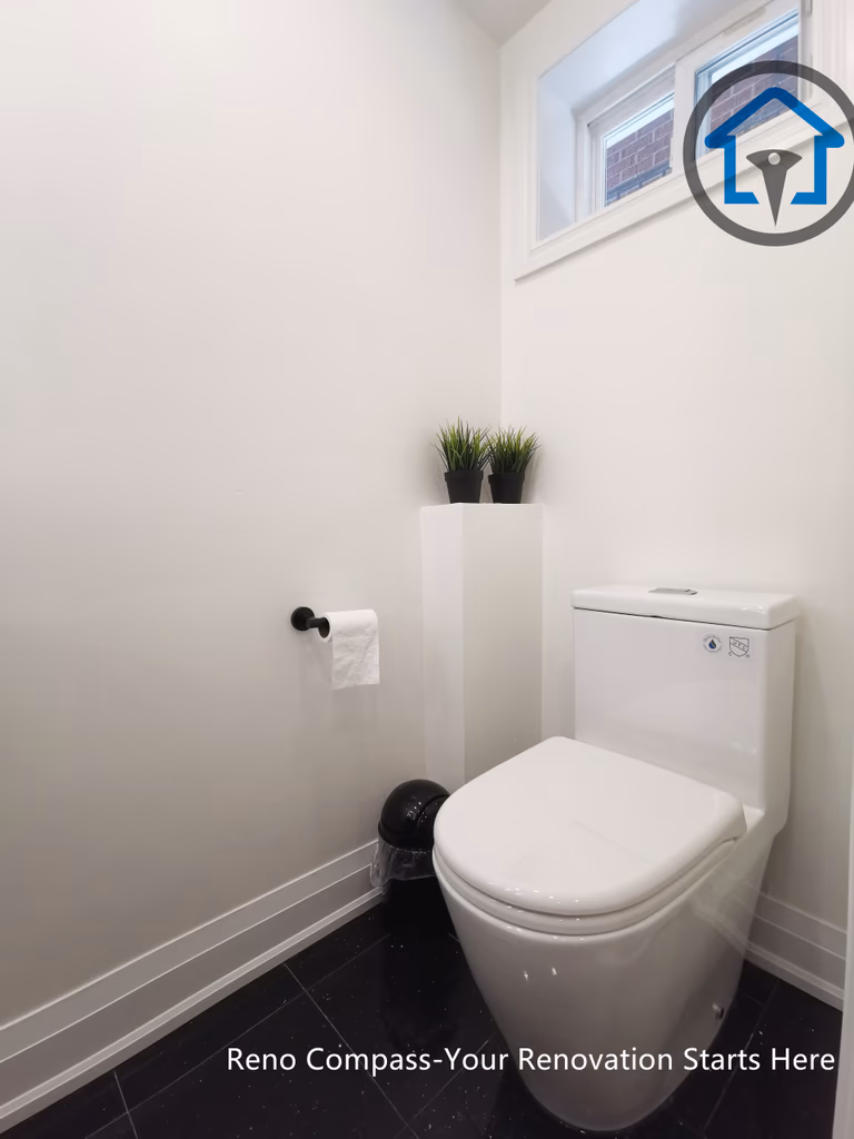 This North York basement renovation features a compact powder room designed with a modern toilet, matte black accessories, and a clean, minimalist layout. Light-colored walls and a small window help improve brightness and ventilation, creating a practical and comfortable basement bathroom completed by a Toronto renovation company focused on efficient space planning.
