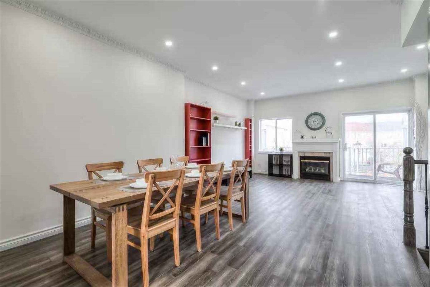 This Thornhill interior renovation features a bright open-concept dining and living area with new wood-style flooring, smooth wall painting, and modern recessed pot lighting. The upgraded staircase with iron railings and refreshed finishes enhance the home’s spacious layout and contemporary style. Completed by a professional Toronto renovation team, this project delivers a clean, functional interior designed for comfortable modern family living.
