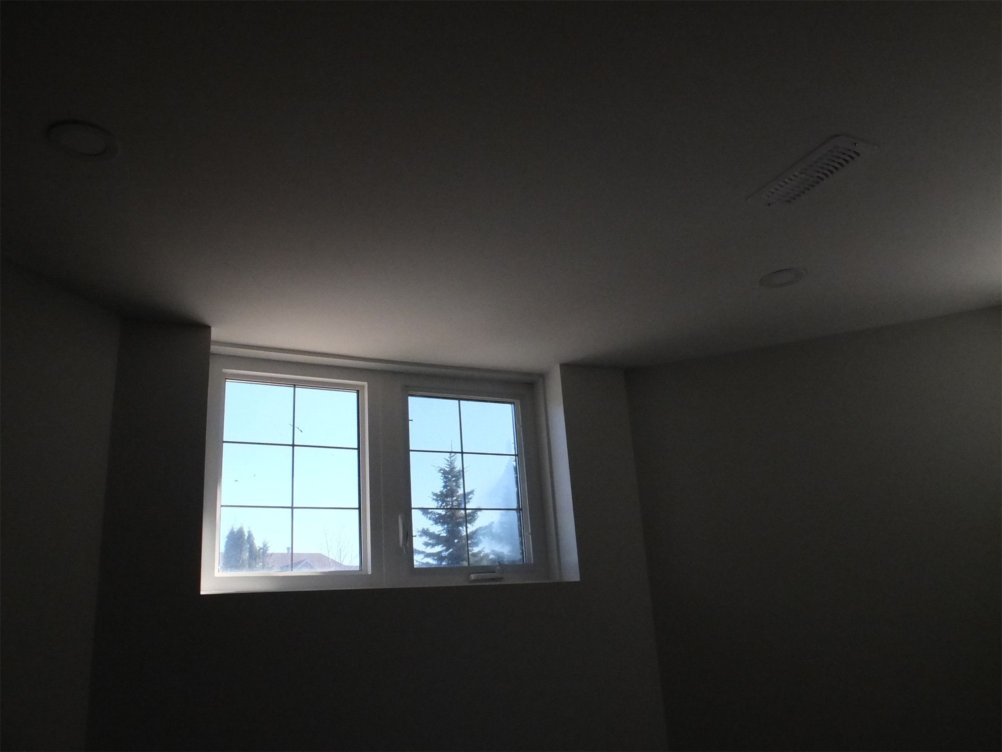 This Richmond Hill basement renovation features well-positioned windows that bring natural light into the finished basement space. The added brightness enhances comfort and livability, making the basement feel more open and suitable for everyday use.