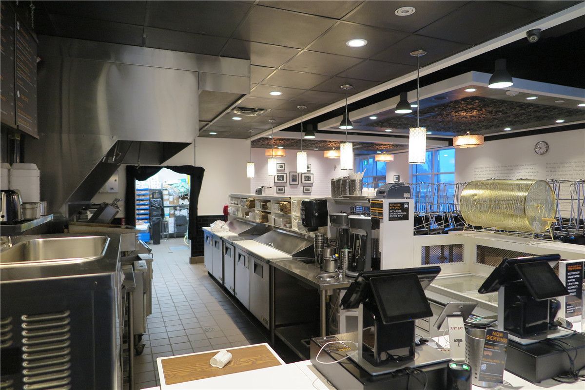 This Toronto restaurant renovation project showcases a fully upgraded commercial kitchen and front service counter area completed by Reno Compass Inc. The scope of work included stainless steel prep stations, commercial-grade ventilation hood installation, new ceiling lighting, POS counter setup, and optimized kitchen workflow layout.

The redesigned space improves operational efficiency, hygiene standards, and customer service flow. Durable flooring, modern pendant lighting, and professional-grade equipment installation ensure the restaurant meets commercial safety codes while maintaining a clean and contemporary appearance.

As a trusted Toronto renovation company, Reno Compass Inc. delivers practical and code-compliant restaurant renovation solutions tailored for food service businesses across the GTA.