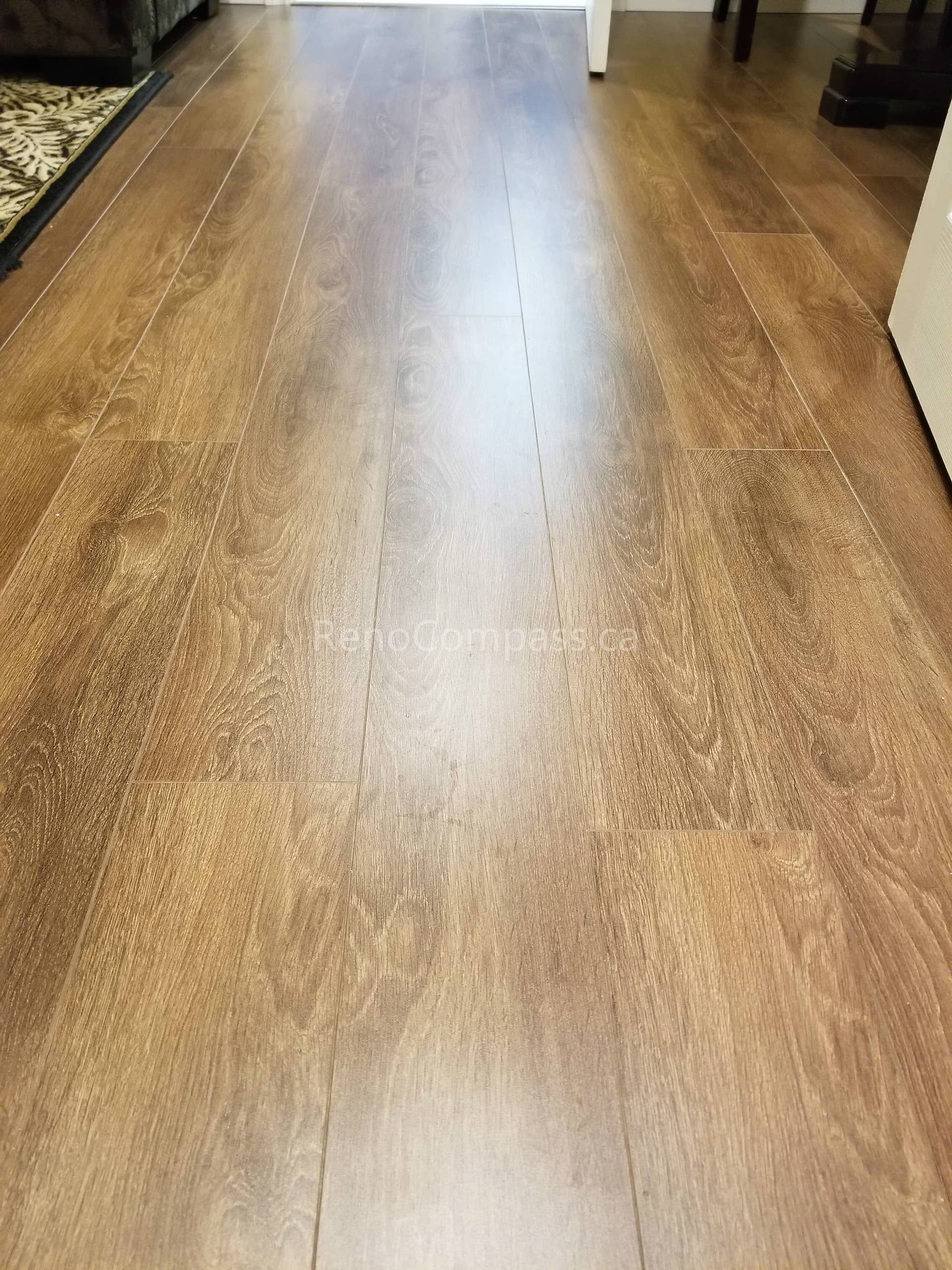 This Vaughan basement renovation project features newly installed high-quality vinyl flooring with a natural wood finish, creating a warm, durable, and modern living space. The upgraded flooring enhances moisture resistance, comfort, and easy maintenance—perfect for a functional and stylish basement environment. Professionally completed by Reno Compass Inc., this basement transformation improves both aesthetics and long-term usability for the homeowner.