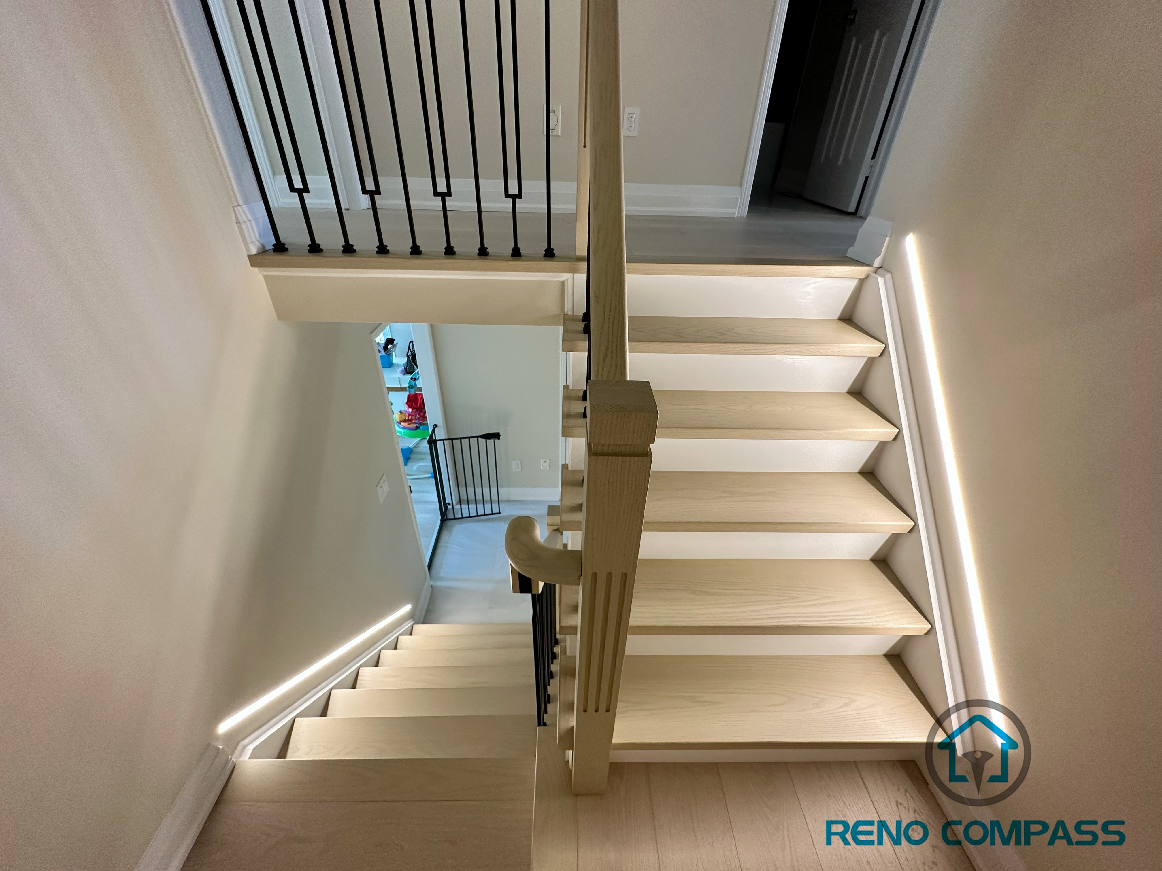 This image showcases our completed light wood staircase renovation in Vaughan. Featuring natural pale wood treads and minimalist metal railings, this design creates a warm, bright, and airy modern feel for the home. We specialize in custom interior renovations across the Greater Toronto and Vaughan area.