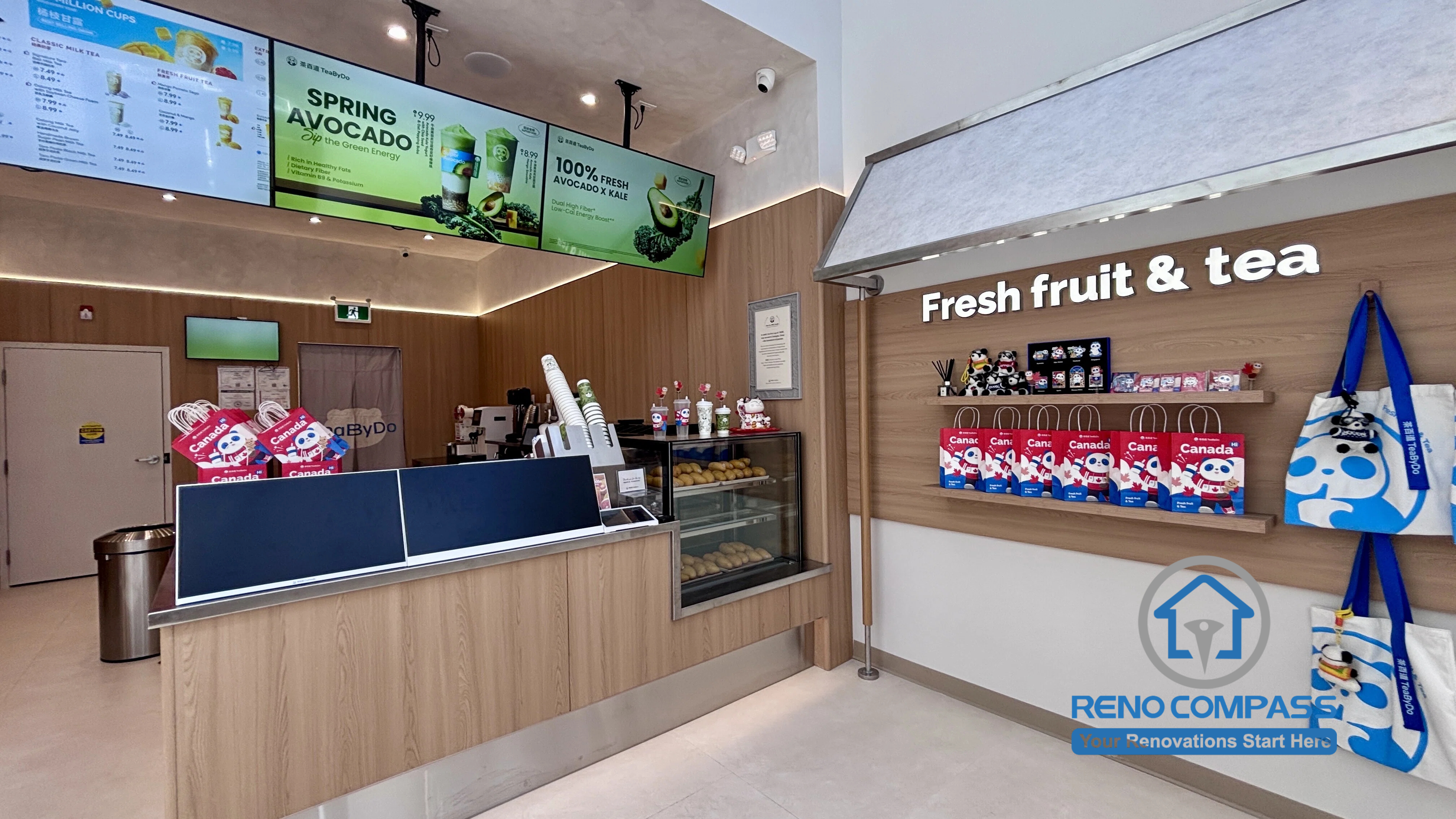 Newly completed TEABYDO bubble tea shop renovation project in Richmond Hill, Toronto GTA. This modern commercial interior features custom front counter millwork, digital menu boards, wood-tone wall finishes, retail display shelving, integrated lighting, and optimized customer flow layout. Designed and built by Reno Compass, specializing in commercial restaurant and bubble tea shop renovations across Toronto and the GTA.