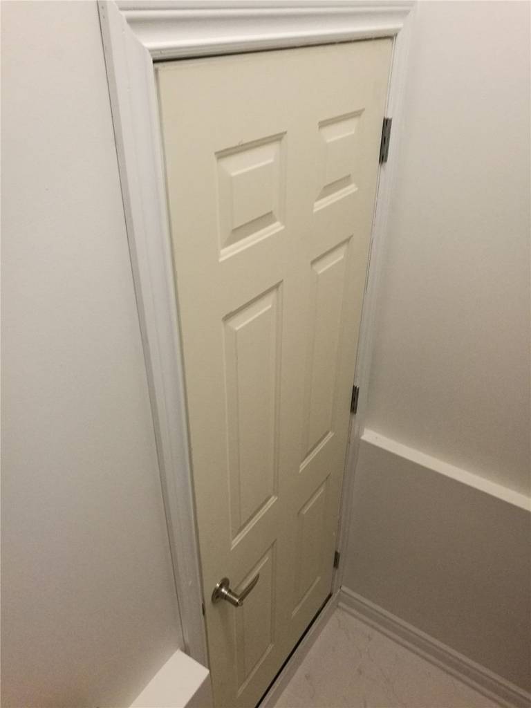 This image showcases a custom interior door installation completed as part of a Vaughan basement renovation project. The compact door design is ideal for under-stair storage or mechanical room access, maximizing space efficiency while maintaining a clean and seamless appearance. Installed by a professional Toronto Renovation Company, the door features precise framing, modern hardware, and smooth finishing that blends naturally with the surrounding walls and trim. The detail-oriented craftsmanship ensures both functionality and long-term durability within the finished basement space.