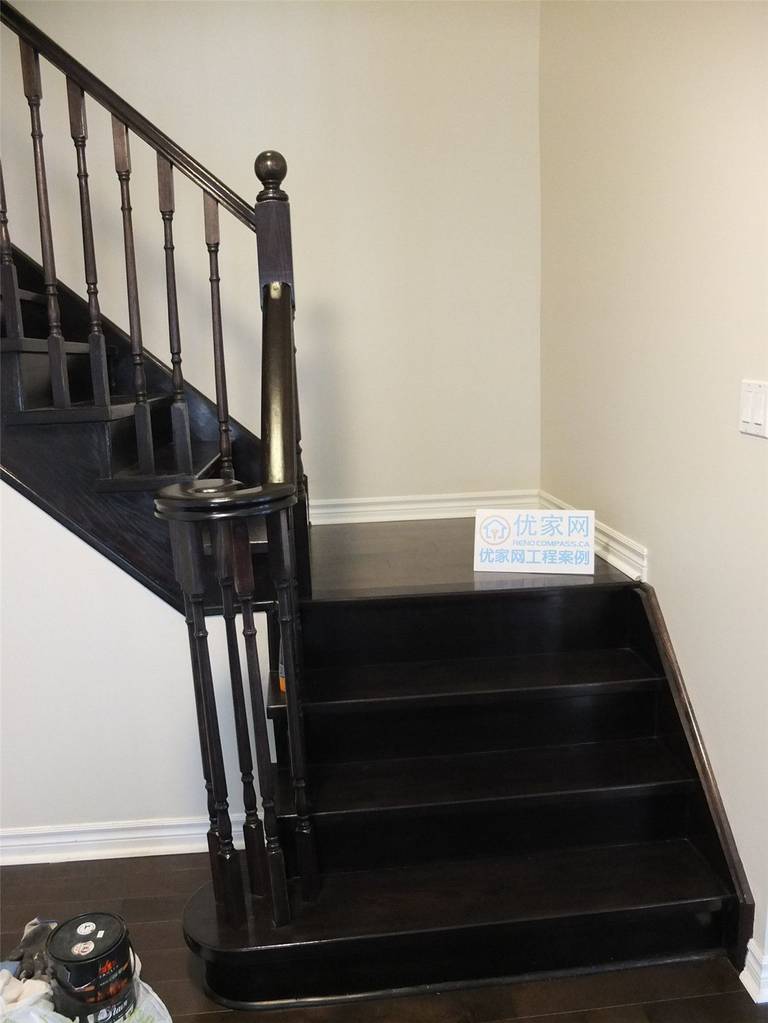 This image highlights the staircase flooring installation as part of a whole house flooring project in Markham. Dark hardwood stair treads are carefully installed to match the main floor, creating a seamless transition between levels. The clean edges, consistent wood tone, and precise craftsmanship enhance both safety and visual continuity, demonstrating professional flooring installation for residential homes in the Greater Toronto Area.