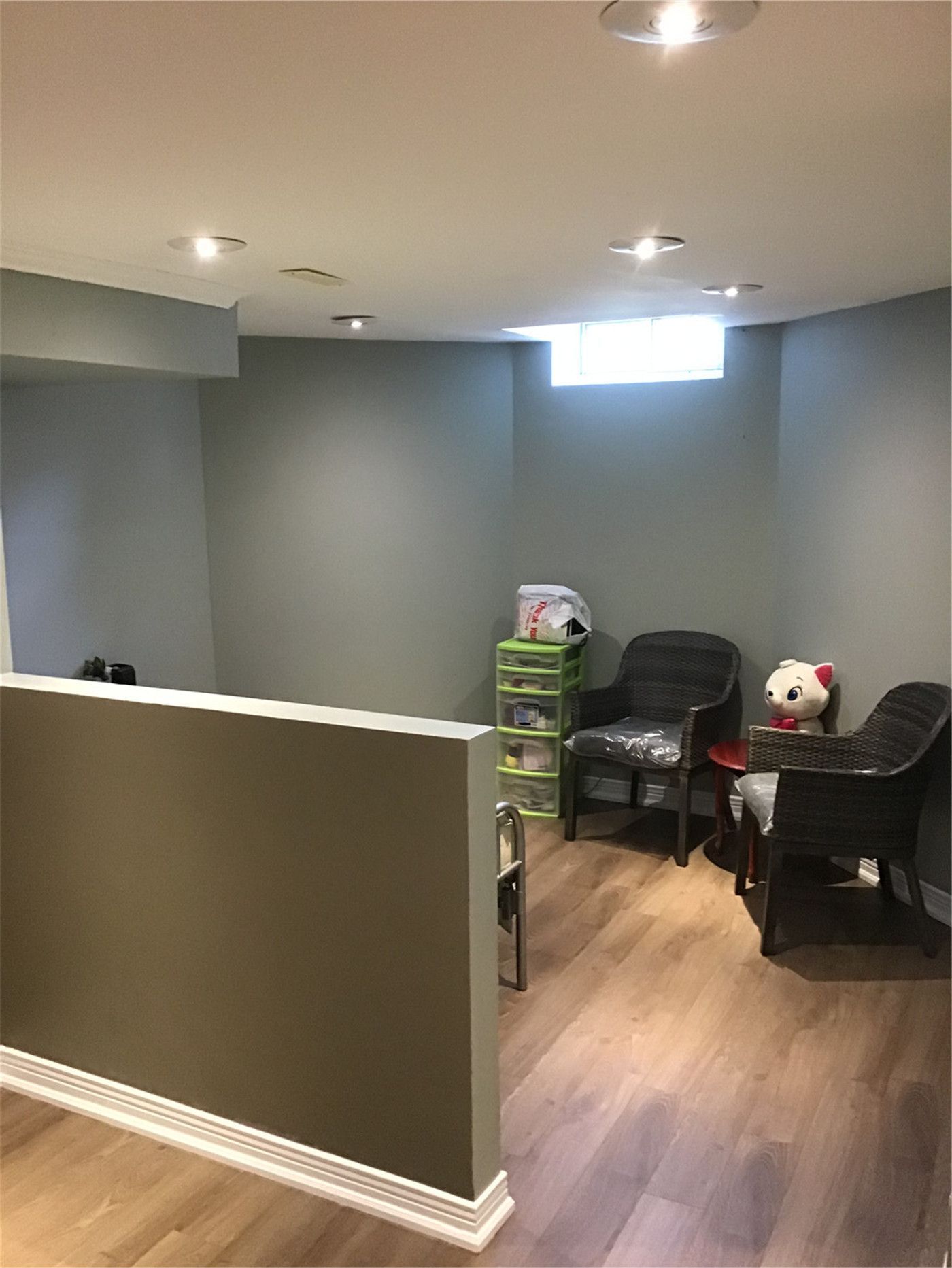 Professional basement renovation in Markham featuring custom half-wall partitions, recessed pot lighting, and high-quality laminate flooring. Maximize your living space with expert craftsmanship.