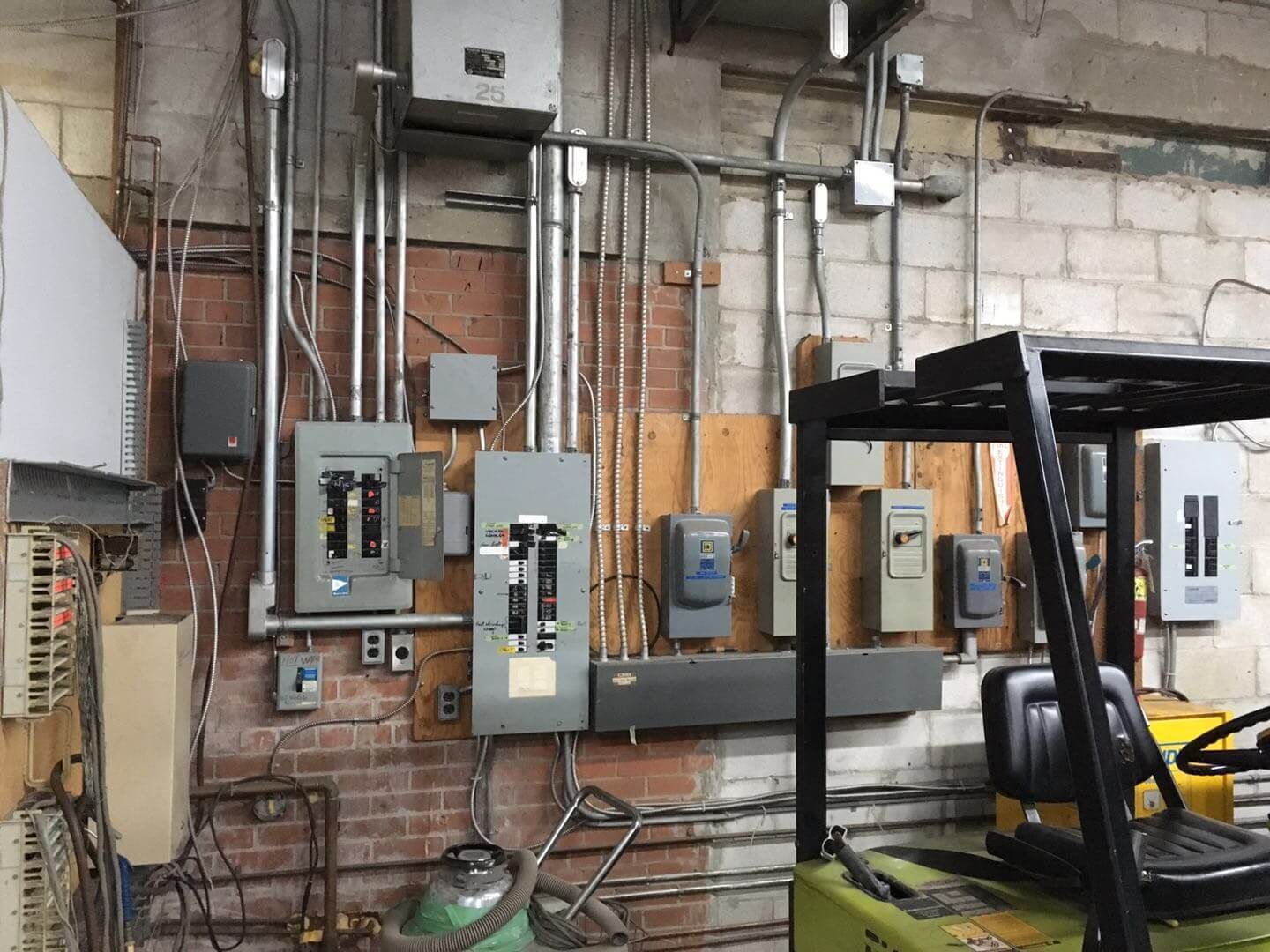 This Toronto factory renovation project showcases a professional industrial electrical system upgrade completed by Reno Compass Inc. The image highlights organized electrical panels, conduit installation, and upgraded power distribution systems designed to improve safety, efficiency, and long-term functionality within a commercial factory environment. As an experienced Toronto renovation company specializing in industrial and commercial spaces, Reno Compass ensures all mechanical and electrical components meet modern standards while supporting heavy-duty operational needs.