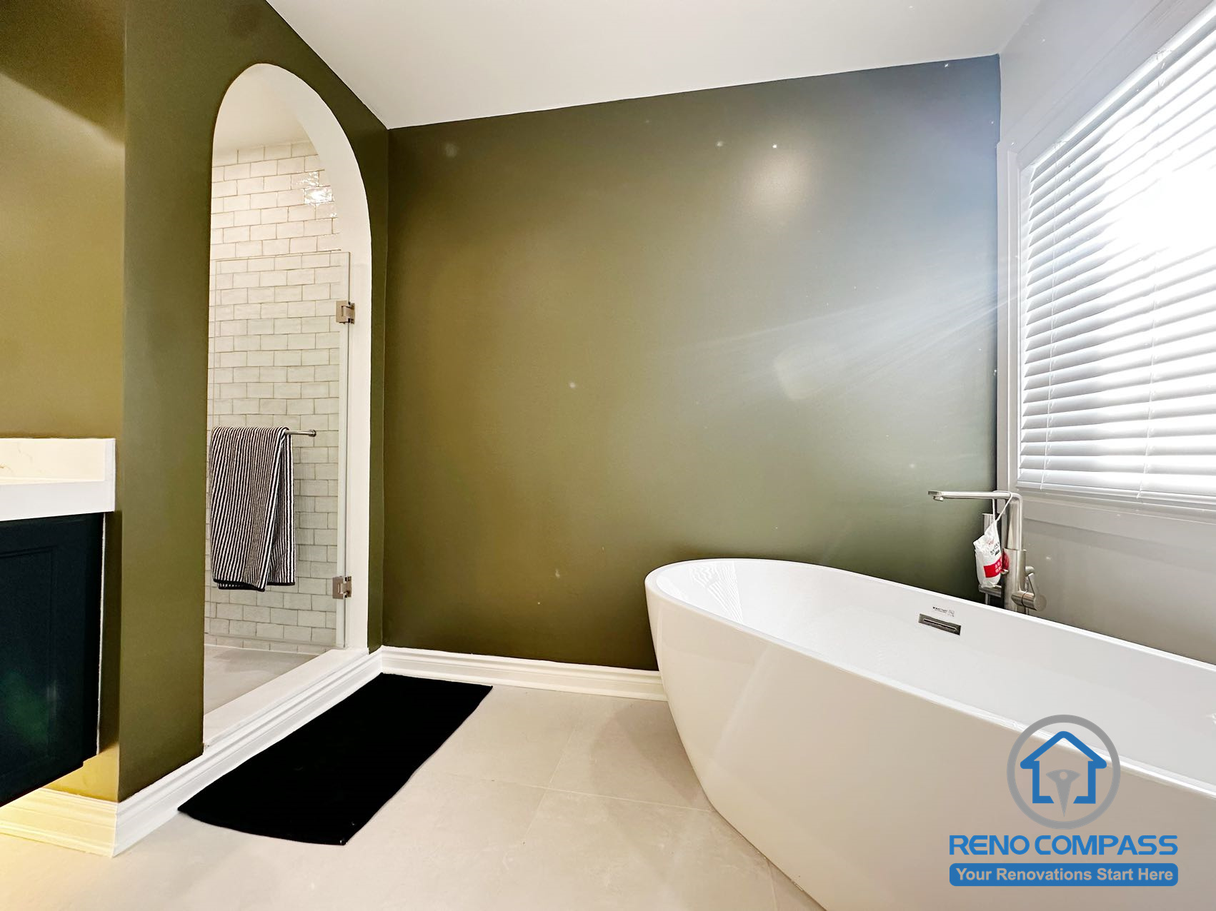 Bathroom tub and shower area from a completed interior renovation project in Markham, featuring a clean layout and a well-defined bathing space by Reno Compass.
