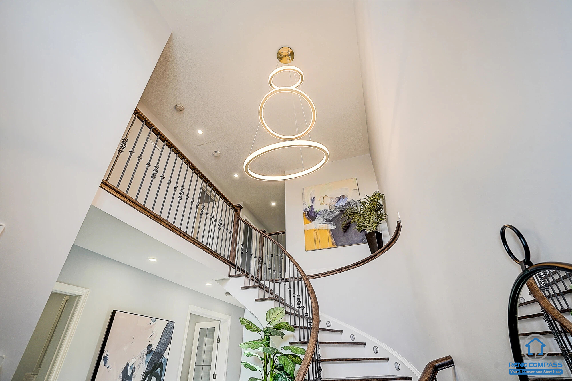 This Vaughan Maple renovation features a dramatic high-ceiling staircase with a modern chandelier and upgraded lighting design. Combined with staircase refinishing, fresh paint, and pot lights, the entry space feels brighter and more luxurious. Completed by a trusted Toronto renovation company.