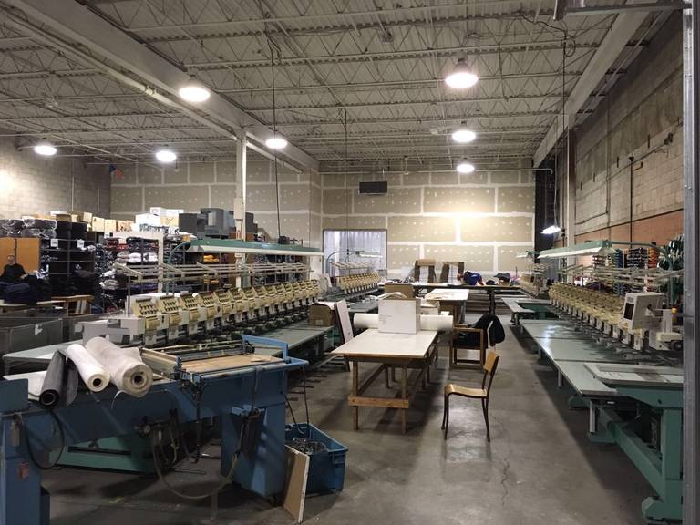This Toronto factory renovation highlights a large-scale industrial interior upgrade designed to improve workflow, safety, and production efficiency. The project showcases an organized production floor with upgraded lighting, ventilation duct systems, and optimized machinery layout to support modern manufacturing operations. Completed by Reno Compass Inc., a trusted Toronto renovation company specializing in commercial and industrial projects, the renovation focuses on durable finishes, improved infrastructure, and a functional layout that enhances daily factory performance and long-term operational reliability.