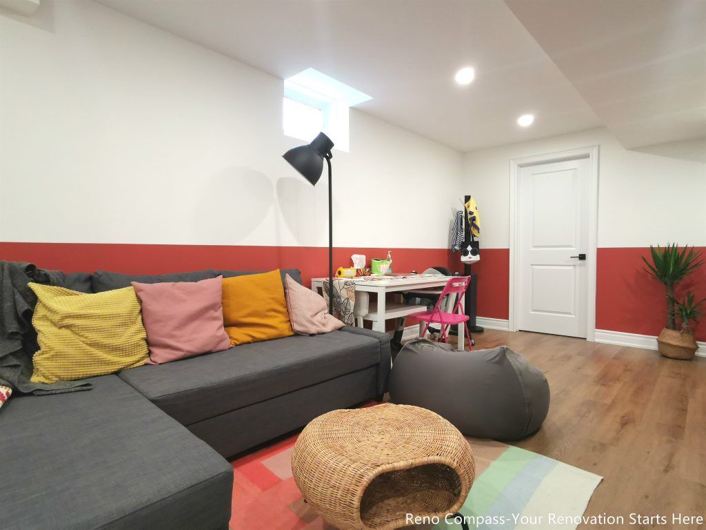 This image features a renovated basement family room in Vaughan, designed as a flexible living space suitable for relaxation, play, and everyday family activities. The layout combines comfortable seating, soft lighting, and durable wood flooring to create a welcoming and practical environment. Recessed ceiling lights and a small window provide balanced illumination, while the open arrangement allows the space to adapt to different uses such as lounging, children’s activities, or casual gatherings. This basement renovation demonstrates the thoughtful space planning and construction quality delivered by a professional Toronto renovation company focused on functional residential interiors.