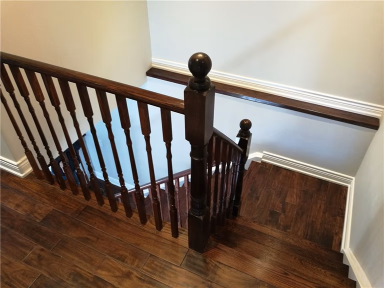 Scarborough whole-house interior renovation featuring refinished hardwood staircase, upgraded railings, and new wood flooring installation. This project highlights detailed craftsmanship, durable materials, and modern interior finishing that enhance both safety and visual appeal by a professional Toronto renovation contractor.