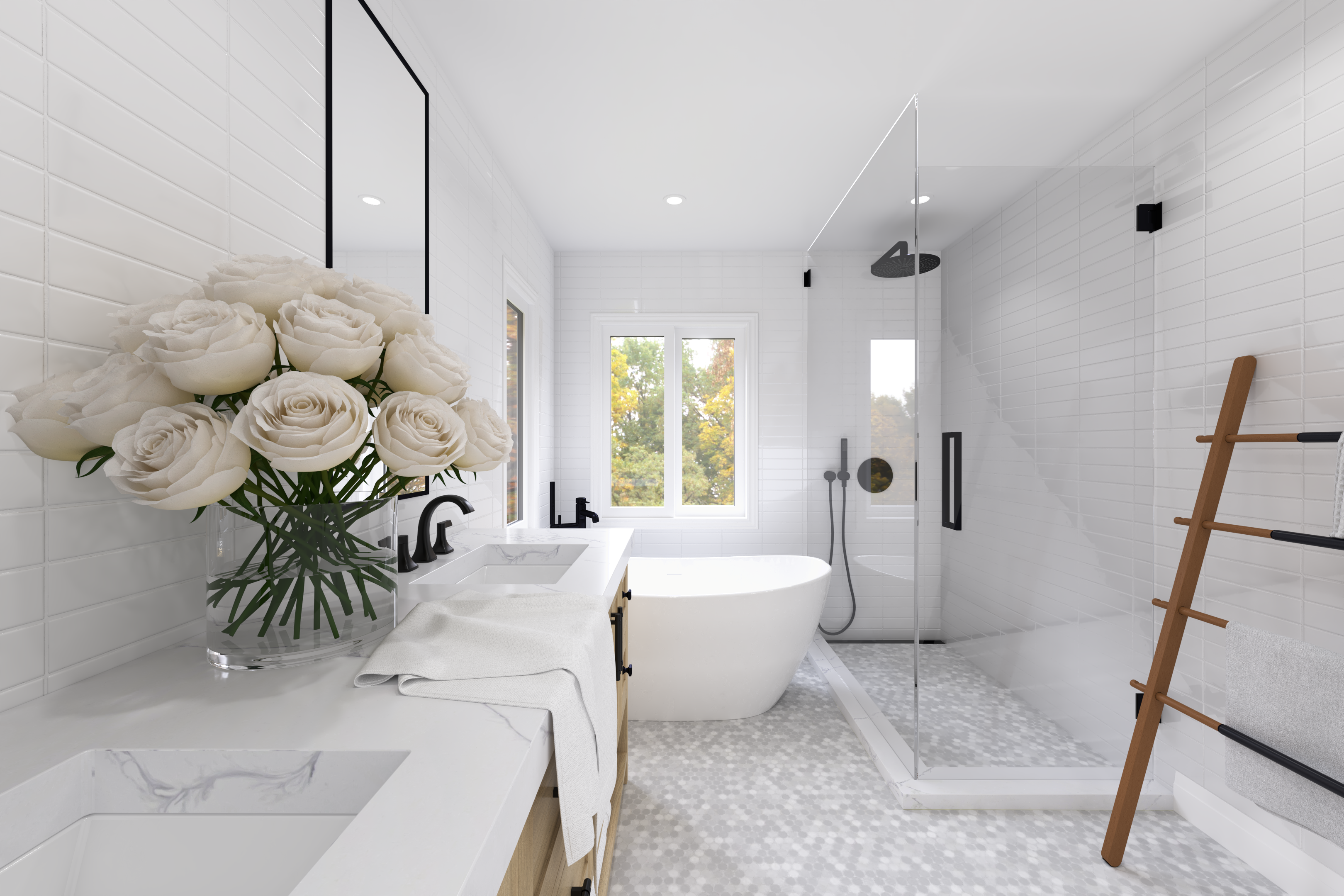 This Oakville interior design bathroom features a clean, light-filled layout with a freestanding bathtub, frameless glass shower, and custom vanity. White wall tiles and soft-toned flooring enhance brightness, while matte black fixtures add subtle contrast. The space is designed to feel open, calm, and comfortable, with a strong focus on everyday functionality and visual balance.