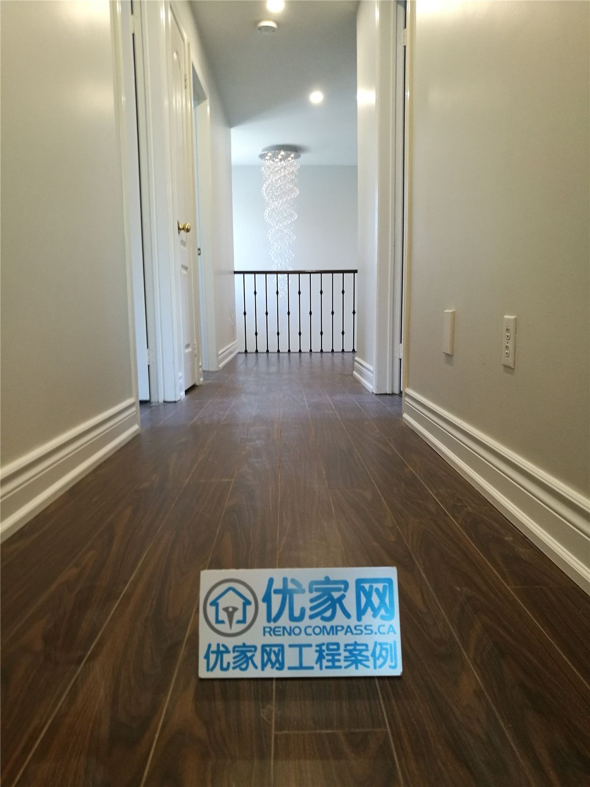 This Mississauga large-scale home renovation showcases a clean and elegant upper hallway transformation featuring rich hardwood flooring, smooth wall finishes, and upgraded baseboards throughout. The long corridor layout enhances visual depth while guiding natural light from adjacent rooms, creating a cohesive and polished second-floor living space.

Modern ceiling lighting and detailed trim work contribute to a refined transitional design that connects bedrooms and staircase areas seamlessly. As part of a full interior renovation project in Mississauga, this hallway upgrade highlights precision flooring installation, balanced lighting design, and consistent finishing across the entire home.