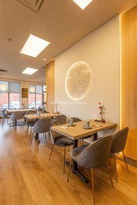 This Richmond Hill Chinese restaurant renovation completed by Toronto renovation company Reno Compass Inc. showcases a bright and modern dining space designed for comfort and efficiency. The upgraded interior features warm wood flooring, custom wall finishes, elegant pendant lighting, and contemporary seating arrangements that enhance the overall dining experience. With a carefully planned layout and refined aesthetic details, the renovation creates a welcoming atmosphere for guests while improving functionality and flow for daily restaurant operations.