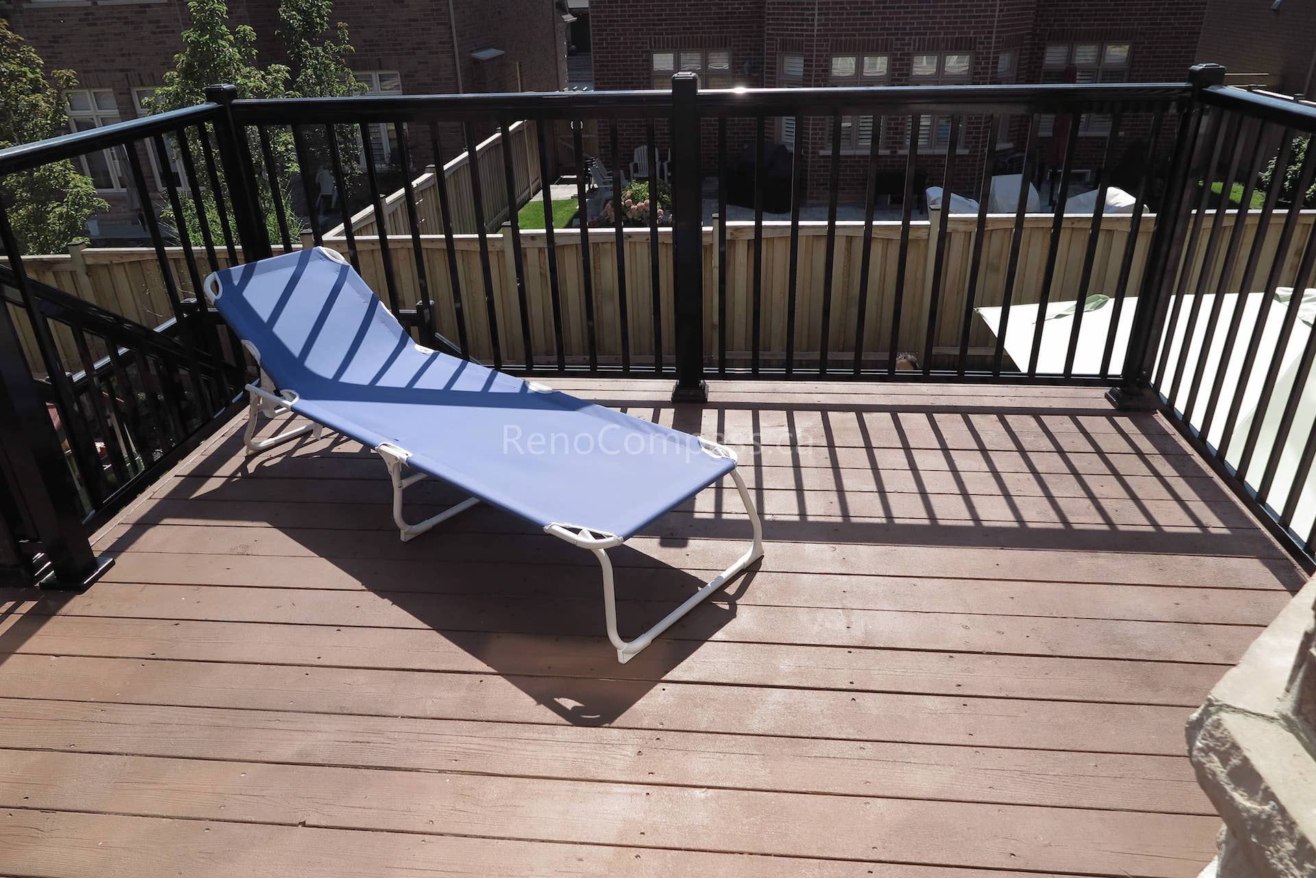 This Markham backyard renovation features a newly upgraded outdoor deck finished with durable wood boards and sleek black aluminum railings for safety and modern appeal. The elevated deck provides a comfortable outdoor lounge area perfect for relaxing and enjoying backyard views. Designed for long-term durability and low maintenance, this outdoor space enhances both functionality and home value. Completed by Reno Compass, the project delivers a stylish and practical backyard deck ideal for everyday outdoor living.