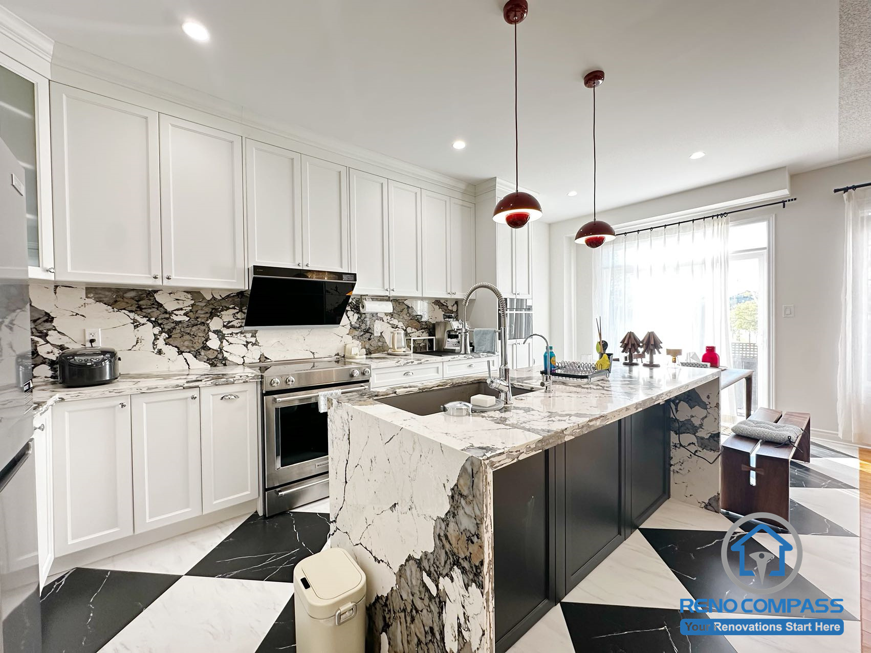 Kitchen with island from a completed interior renovation project in Markham, featuring a functional layout and well-organized cooking and dining space by Reno Compass.