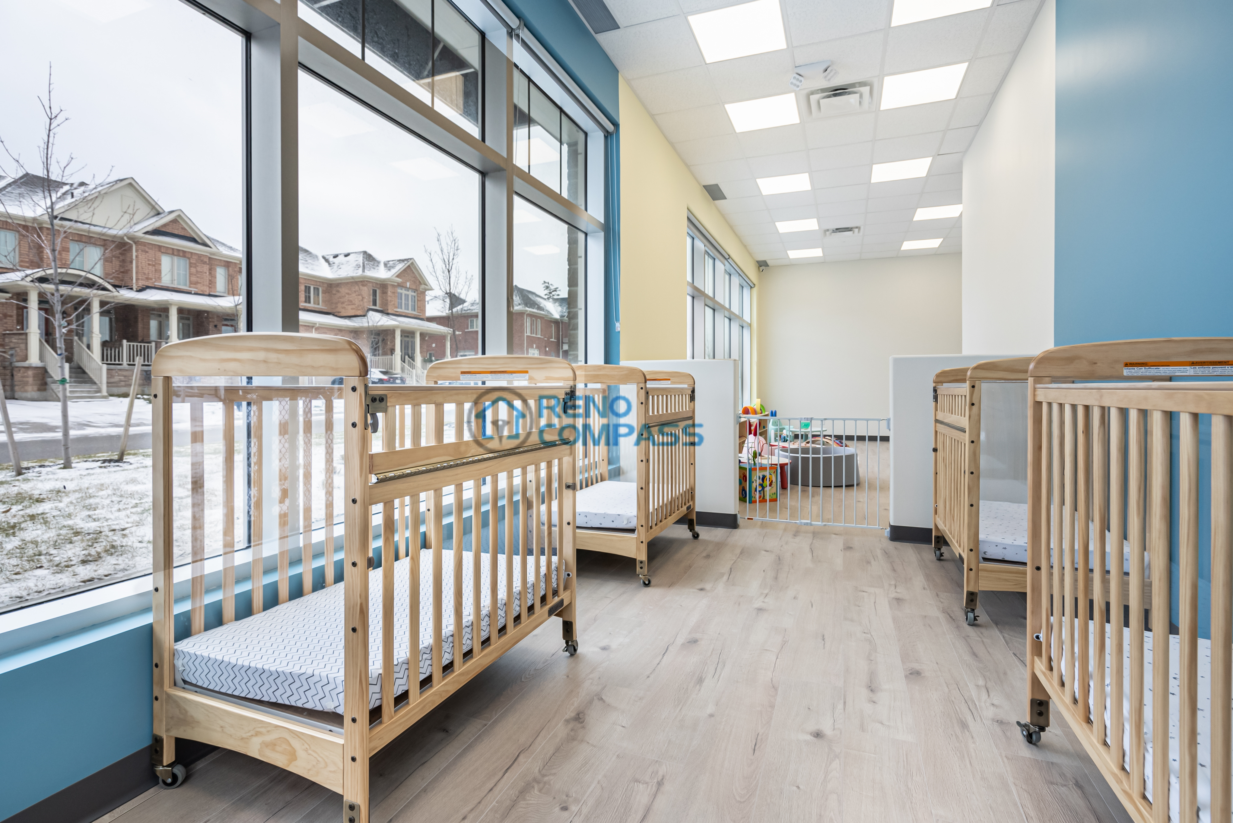 Renovated daycare hallway and common area in Richmond Hill with improved lighting, clear circulation, and durable materials to support high daily usage.
