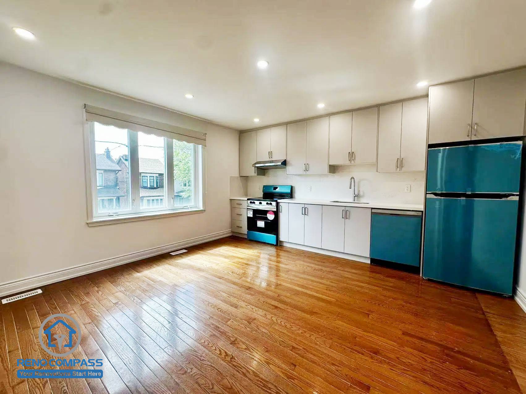 This second-floor rental unit features an open-concept kitchen and living area with ample natural light and hardwood flooring. Designed for a Toronto legal 3-unit conversion, the layout maximizes space efficiency and tenant comfort, making it ideal for long-term rental use.