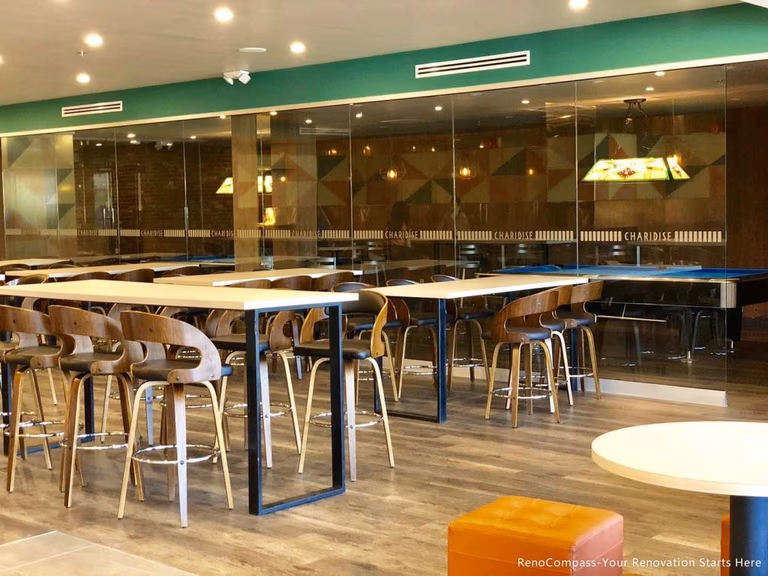 This Barrie commercial renovation features a modern bubble tea shop dining area with custom seating, durable flooring, and contemporary lighting design. The open layout and large glass storefront create a bright and welcoming environment for customers. Completed by Reno Compass Inc., a trusted Toronto renovation company, this project highlights professional commercial construction tailored for cafés, bubble tea shops, and retail spaces.