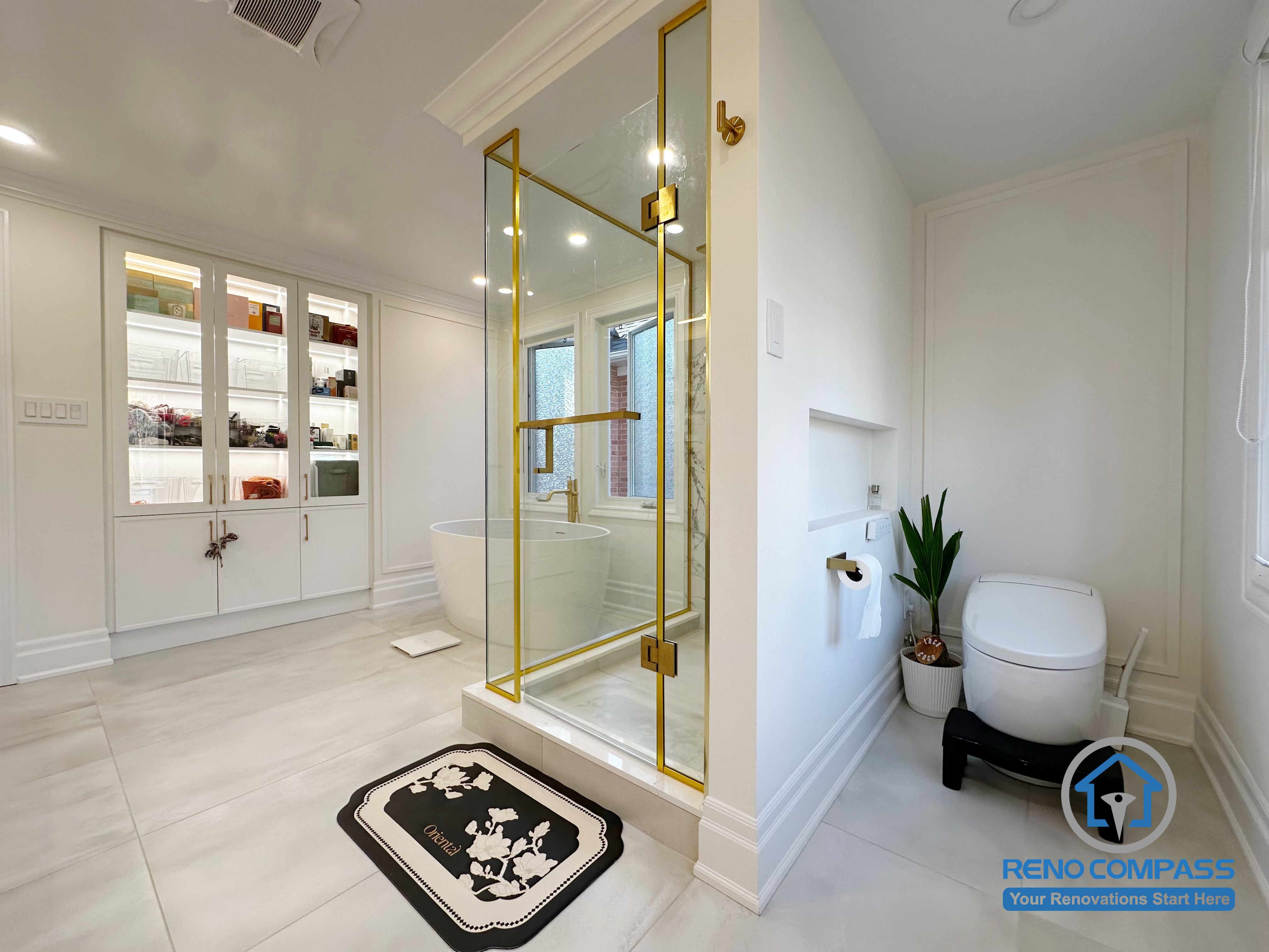 This Markham bathroom renovation highlights a well-planned layout that separates wet and dry zones for daily comfort and efficiency. A clear glass shower enclosure with refined metal accents defines the shower area while preserving openness. Built-in cabinetry and wall niches provide practical storage without disrupting the clean lines of the space. Soft neutral tones, balanced proportions, and thoughtful detailing create a bathroom that feels elegant, organized, and timeless.