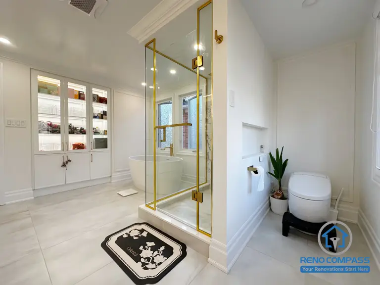 This Markham bathroom renovation highlights a well-planned layout that separates wet and dry zones for daily comfort and efficiency. A clear glass shower enclosure with refined metal accents defines the shower area while preserving openness. Built-in cabinetry and wall niches provide practical storage without disrupting the clean lines of the space. Soft neutral tones, balanced proportions, and thoughtful detailing create a bathroom that feels elegant, organized, and timeless.