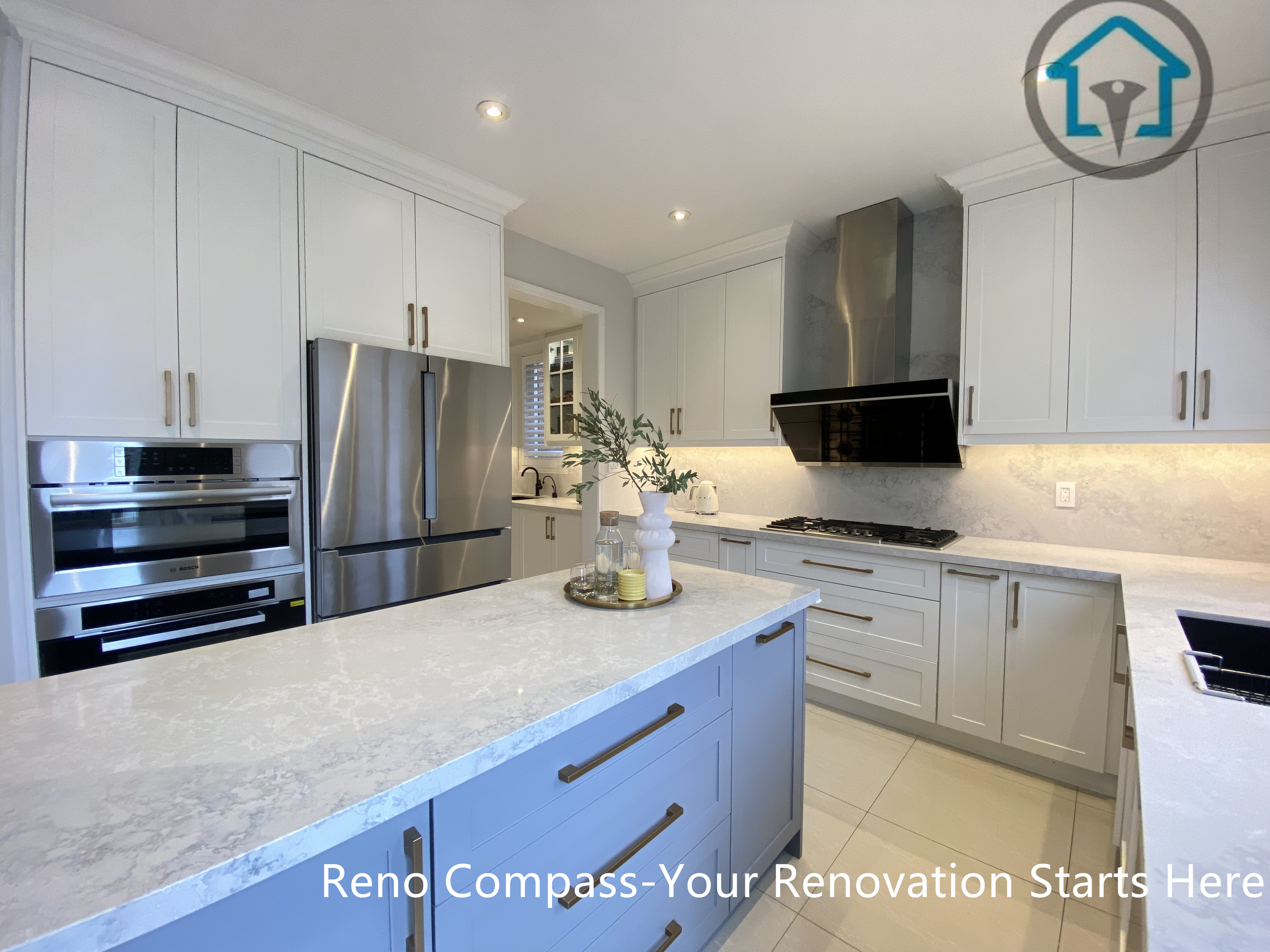 This image highlights the kitchen island and built-in appliance wall in this Markham kitchen renovation. Custom cabinetry integrates a refrigerator and wall oven seamlessly, while the central island provides additional prep space and storage. The balanced layout and consistent finishes create a clean, cohesive kitchen designed for everyday use. Designed and completed by Reno Compass, this project reflects a refined and practical approach to kitchen renovation in Markham.