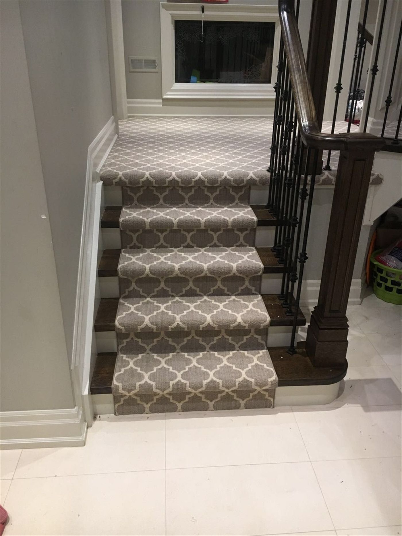 This Toronto interior carpet renovation project showcases a professionally installed staircase carpet runner designed to enhance comfort, safety, and style. The patterned carpet was custom-cut and fitted to align precisely with each stair tread, creating a clean and cohesive look from the upper level to the lower landing.

The neutral-toned runner complements the dark wood stairs and black iron railings, adding warmth while protecting high-traffic areas from wear. Installed by an experienced Toronto renovation company, this staircase carpet upgrade improves daily functionality, reduces noise, and brings a polished, modern finish to the home’s interior stairway.