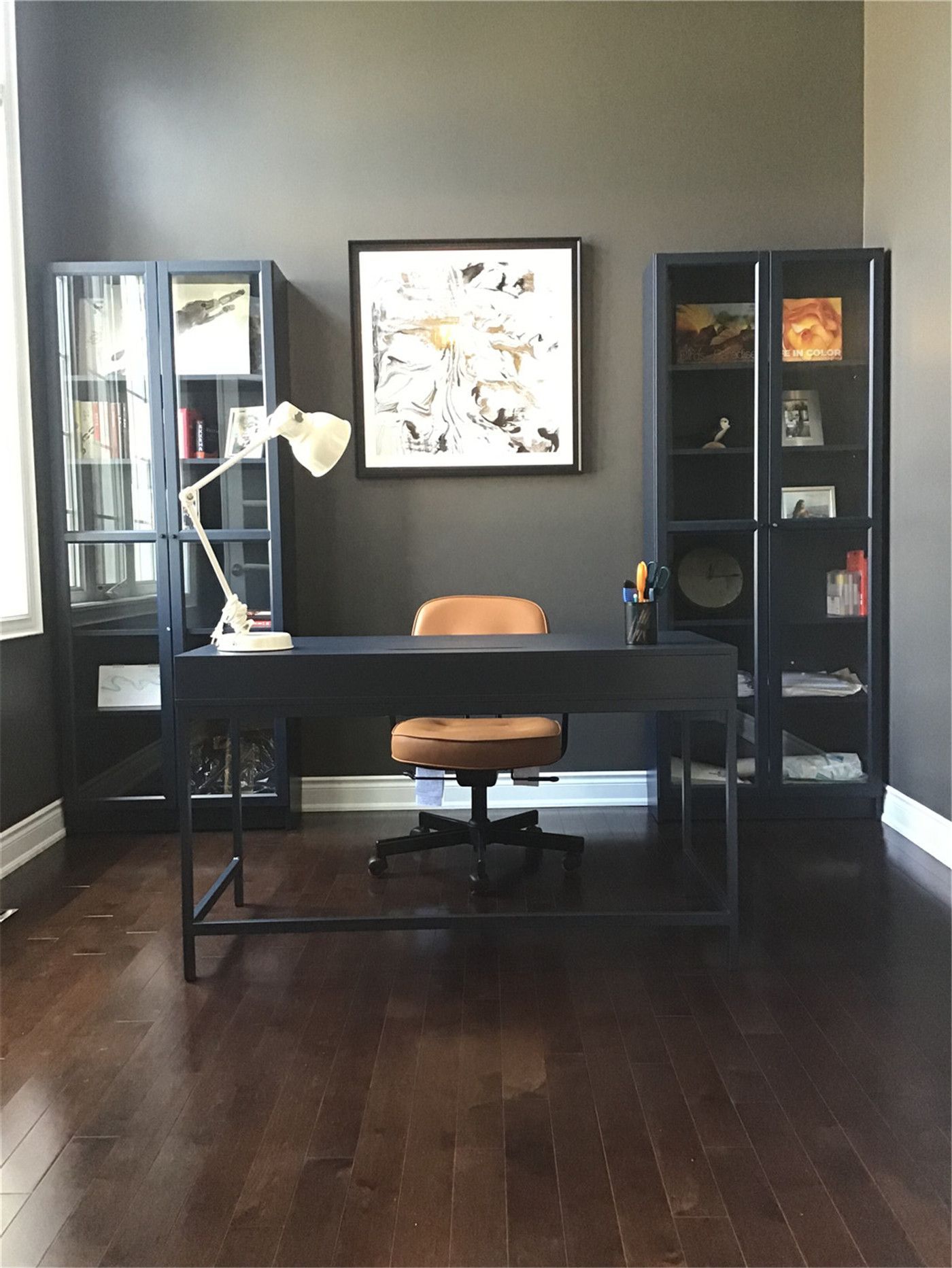 This Markham full home renovation features a stylish home office with hardwood flooring, modern furnishings, and practical storage solutions. The clean layout and natural lighting create an ideal workspace for productivity and comfort. Completed by a trusted Toronto Renovation Company, this design reflects the growing demand for functional and elegant work-from-home environments.