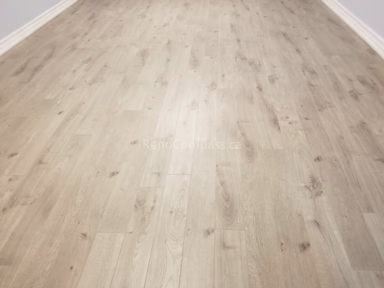 This Mississauga interior renovation features elegant large-format tile flooring with a polished finish that enhances brightness and creates a clean, modern look. The neutral-toned tiles provide durability, easy maintenance, and a timeless aesthetic suitable for kitchens, bathrooms, and main living areas.

Installed by Reno Compass Inc., this professional tile flooring upgrade delivers precision craftsmanship and a high-end finish that elevates both functionality and property value.