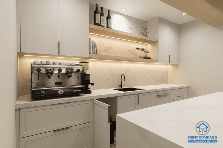 Close-up of basement bar cabinetry and countertop in Newmarket renovation. Features custom cabinets, under-cabinet lighting, and modern backsplash design.