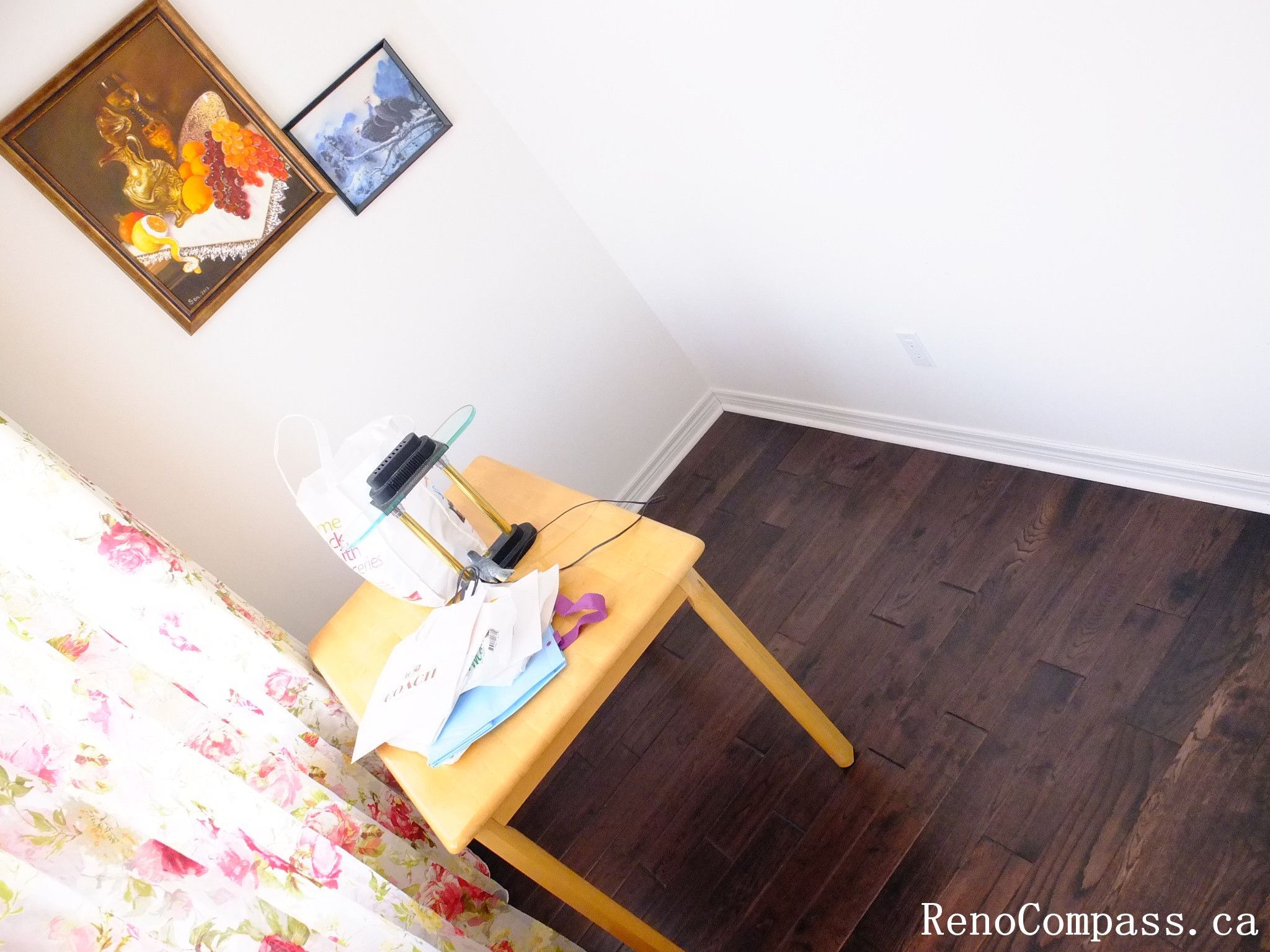 Toronto home hardwood flooring installation featuring deep-toned wood floors throughout the hallway and upper level. This professional flooring renovation enhances brightness, durability, and visual continuity, completed by Reno Compass for a clean and modern interior upgrade.