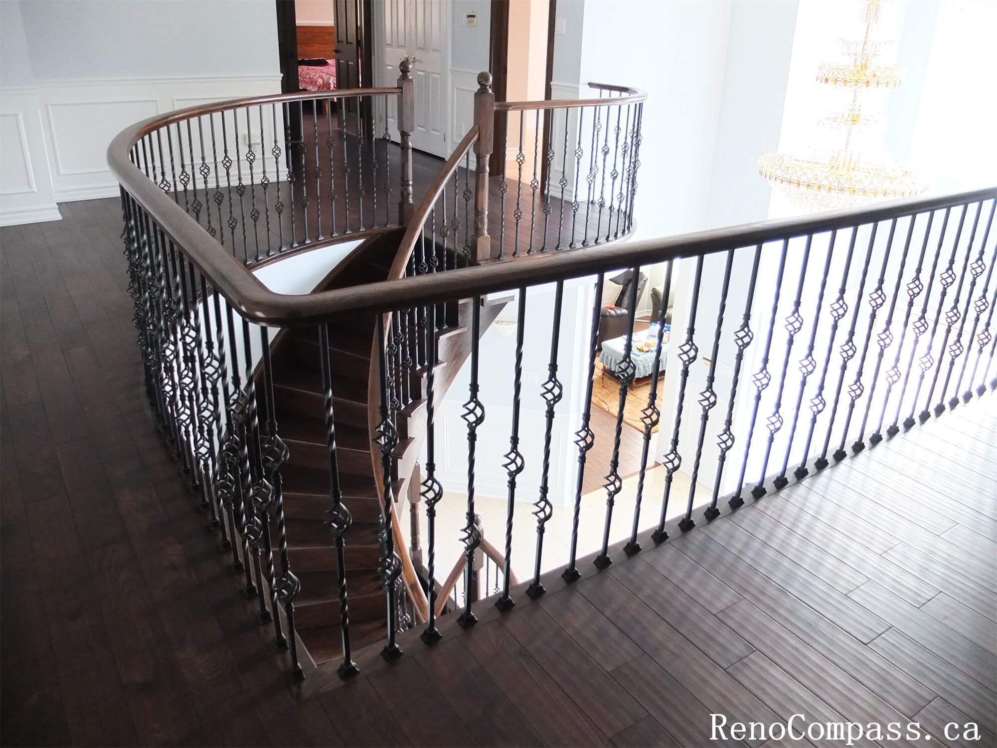 This Richmond Hill interior renovation features an upgraded second-floor hallway and open staircase area with custom wood flooring and decorative iron railings. The curved balcony design enhances the home’s architectural flow while providing a bright and spacious upper-level living environment. Modern finishes, clean wall detailing, and improved lighting create a refined and cohesive interior style throughout the home. Completed by a professional Toronto renovation company, this upper-level renovation adds both visual elegance and functional value to the property.
