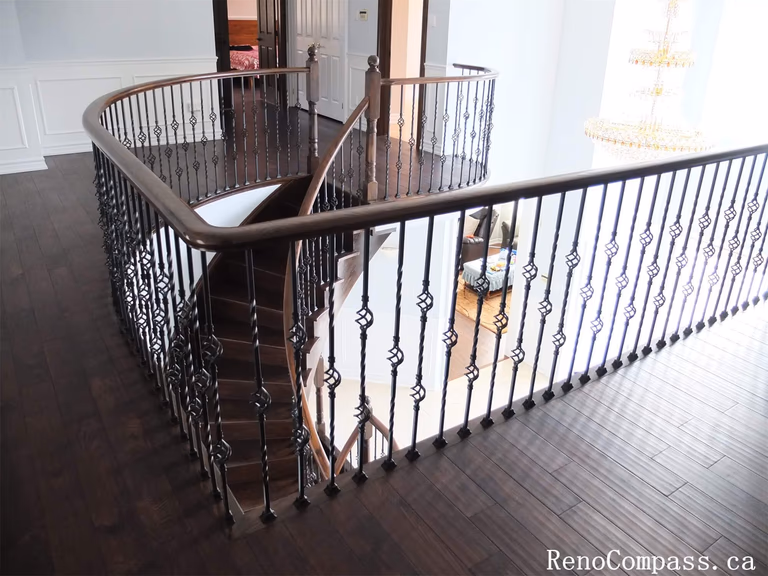 This Richmond Hill interior renovation features an upgraded second-floor hallway and open staircase area with custom wood flooring and decorative iron railings. The curved balcony design enhances the home’s architectural flow while providing a bright and spacious upper-level living environment. Modern finishes, clean wall detailing, and improved lighting create a refined and cohesive interior style throughout the home. Completed by a professional Toronto renovation company, this upper-level renovation adds both visual elegance and functional value to the property.