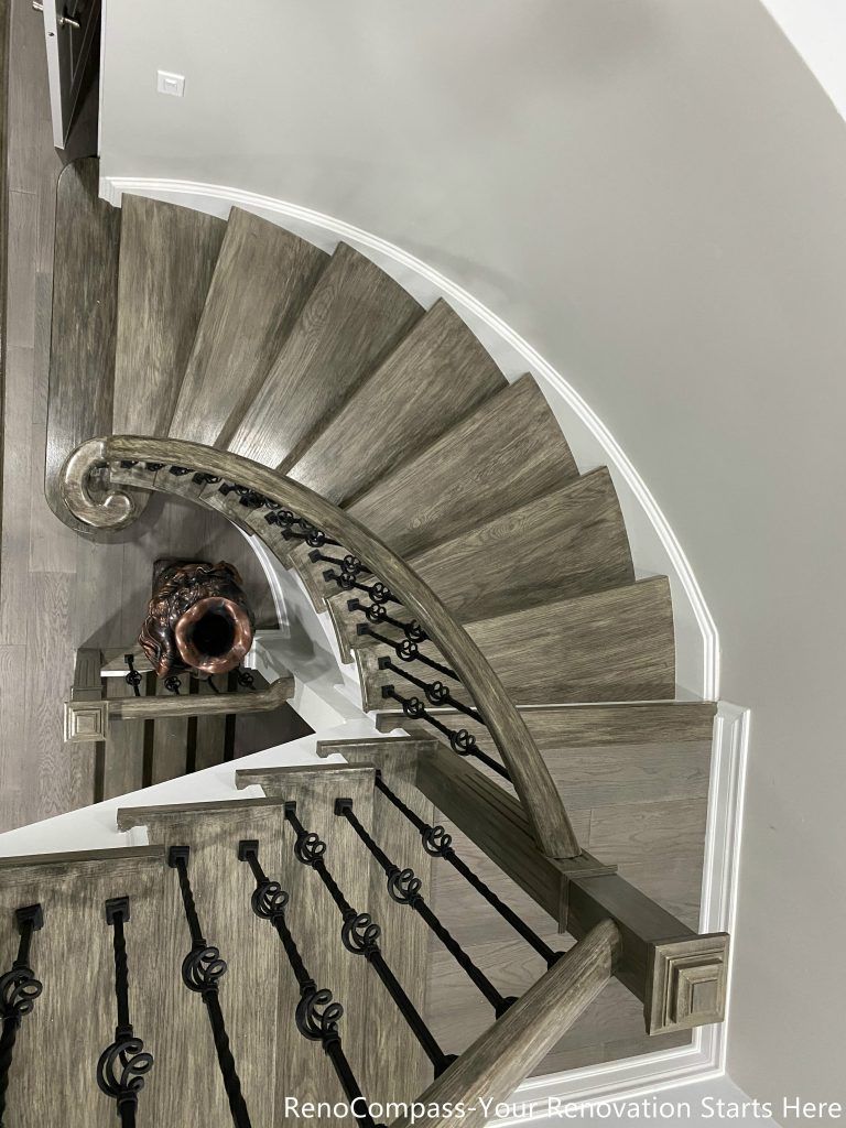 This Mississauga interior renovation features a beautifully crafted curved staircase with custom wood treads, modern iron balusters, and elegant trim detailing. The upgraded staircase enhances the home’s architectural character while improving durability and safety. Paired with new flooring and clean contemporary finishes, the design creates a striking focal point that connects multiple levels seamlessly. Completed by a professional Toronto renovation company, this renovation highlights quality craftsmanship and modern interior design that elevates both visual appeal and property value.