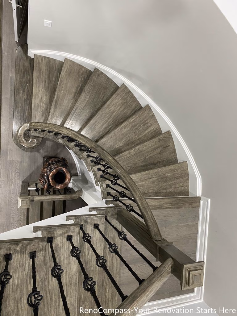 This Mississauga interior renovation features a beautifully crafted curved staircase with custom wood treads, modern iron balusters, and elegant trim detailing. The upgraded staircase enhances the home’s architectural character while improving durability and safety. Paired with new flooring and clean contemporary finishes, the design creates a striking focal point that connects multiple levels seamlessly. Completed by a professional Toronto renovation company, this renovation highlights quality craftsmanship and modern interior design that elevates both visual appeal and property value.