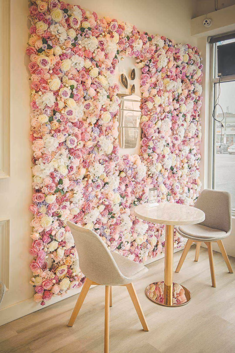 This Toronto milk tea shop renovation features a beautifully designed floral feature wall that creates a warm and Instagram-worthy seating area for customers. The custom flower wall installation enhances the shop’s visual identity and provides a perfect photo backdrop, helping attract foot traffic and improve in-store experience. Paired with modern café seating, soft lighting, and wood flooring, the space delivers a welcoming and stylish environment ideal for bubble tea and dessert shops. Completed by a professional Toronto renovation company, this commercial interior project combines aesthetic design with functional layout planning to elevate the overall retail atmosphere and customer engagement.