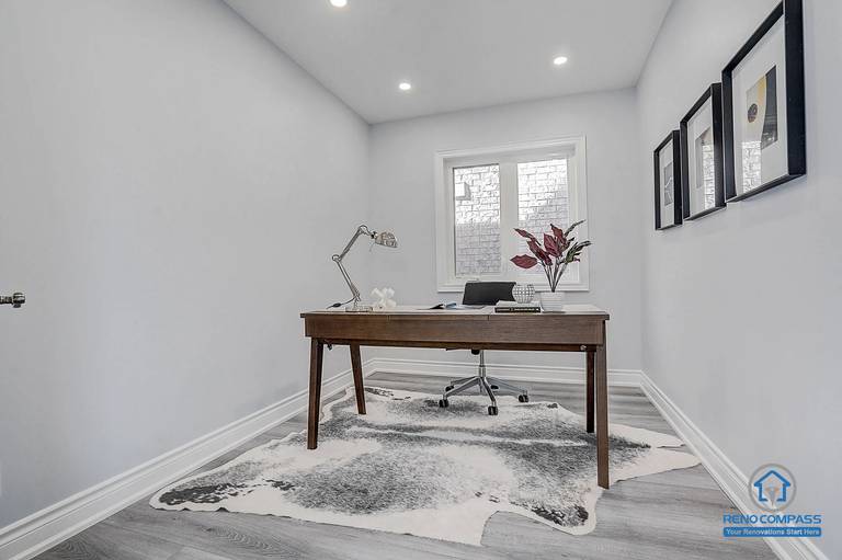 Home office renovation in Vaughan featuring new flooring, pot lights installation, and clean wall painting for a bright and functional workspace.