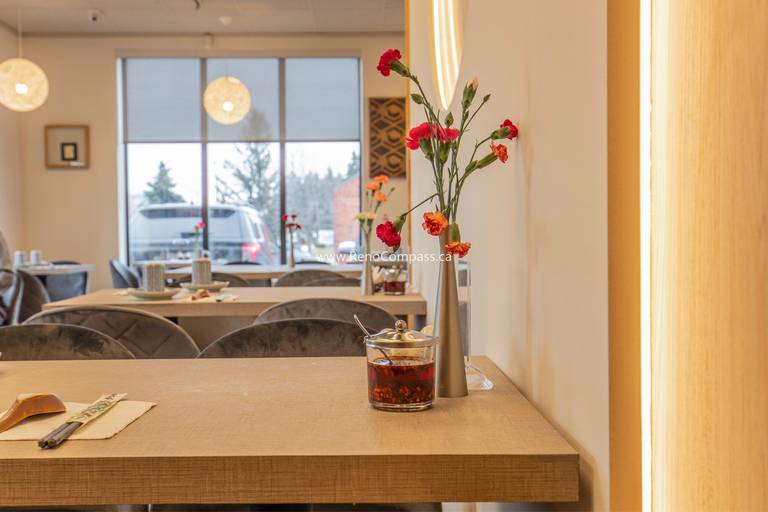 This Richmond Hill Chinese restaurant renovation by Toronto renovation company Reno Compass Inc. highlights refined dining table details and a warm, modern interior atmosphere. The upgraded space features custom dining tables, soft ambient lighting, elegant floral décor, and contemporary seating that enhance the overall customer experience. Designed to balance aesthetics and functionality, the renovation creates a welcoming and comfortable environment that elevates the restaurant’s brand image while supporting efficient daily operations.