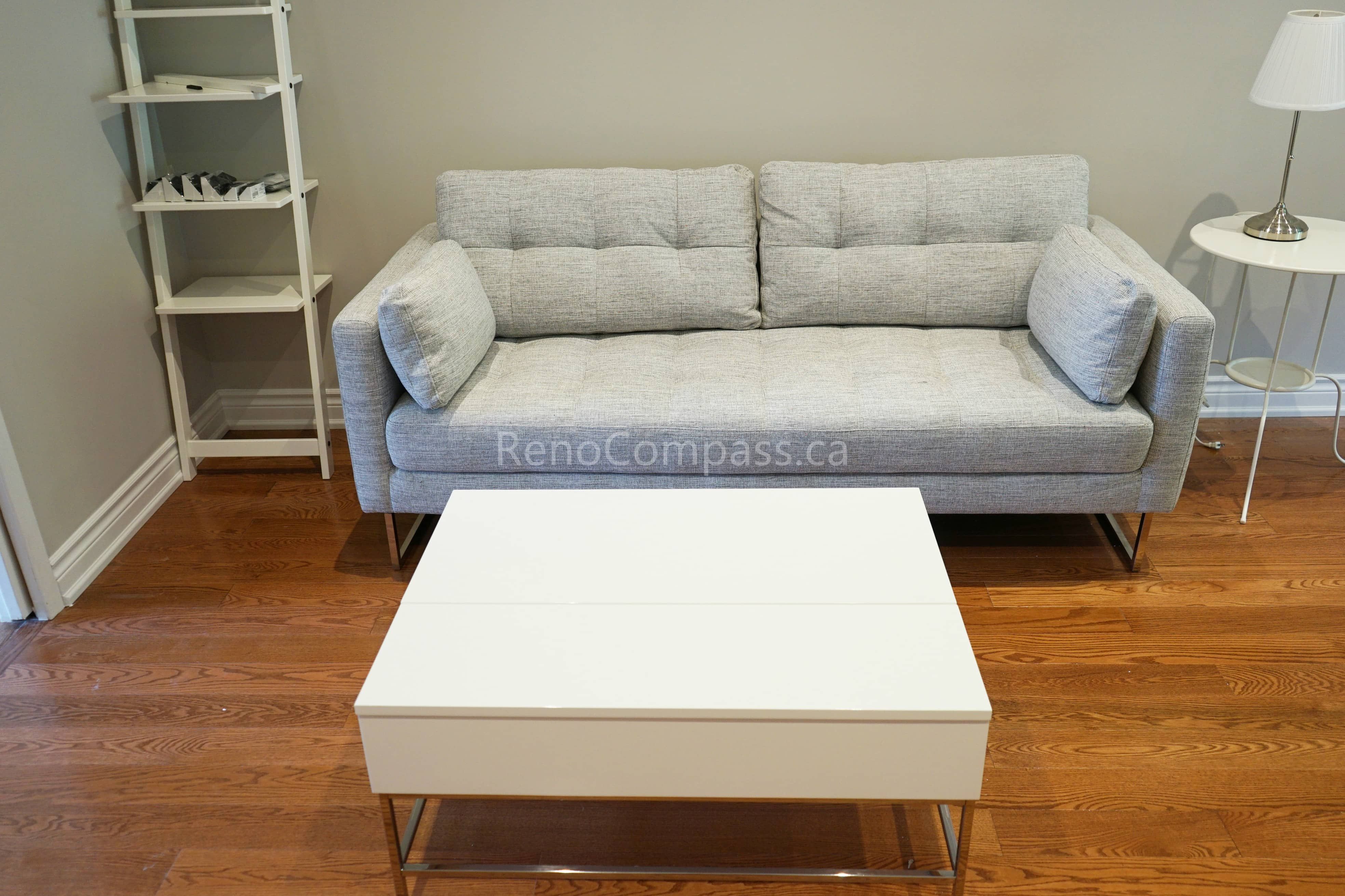 This North York interior renovation highlights a clean and functional living room furniture layout paired with upgraded hardwood flooring. The neutral sofa design, modern coffee table, and warm wood tones create a balanced and comfortable living space. Completed by an experienced Toronto renovation company, this project reflects attention to detail, practical space planning, and high-quality interior renovation workmanship for Toronto homes.