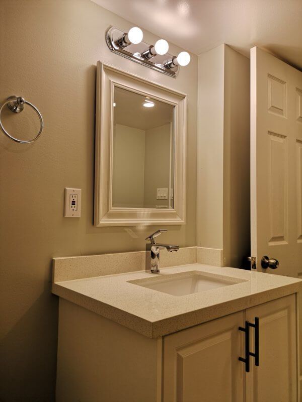 This Markham basement bathroom renovation features a modern vanity installation, upgraded tile flooring, and clean neutral finishes for a fresh and functional space. Completed by a trusted Toronto renovation company, the project improves basement comfort, storage, and overall home value while creating a bright and easy-to-maintain bathroom design.