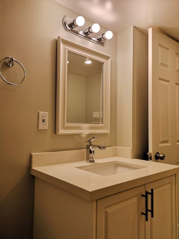This Markham basement bathroom renovation features a modern vanity installation, upgraded tile flooring, and clean neutral finishes for a fresh and functional space. Completed by a trusted Toronto renovation company, the project improves basement comfort, storage, and overall home value while creating a bright and easy-to-maintain bathroom design.