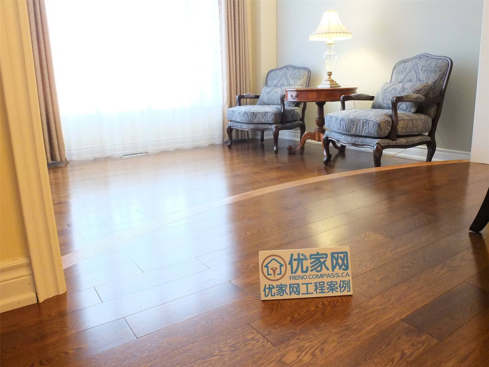 This Aurora flooring renovation highlights the installation of rich hardwood flooring that enhances the warmth and sophistication of the living room area. The smooth wood planks reflect natural light from the large window, creating a bright and inviting atmosphere. Completed by a professional Toronto renovation company, this flooring upgrade improves durability, visual appeal, and the overall comfort of the home’s interior space.