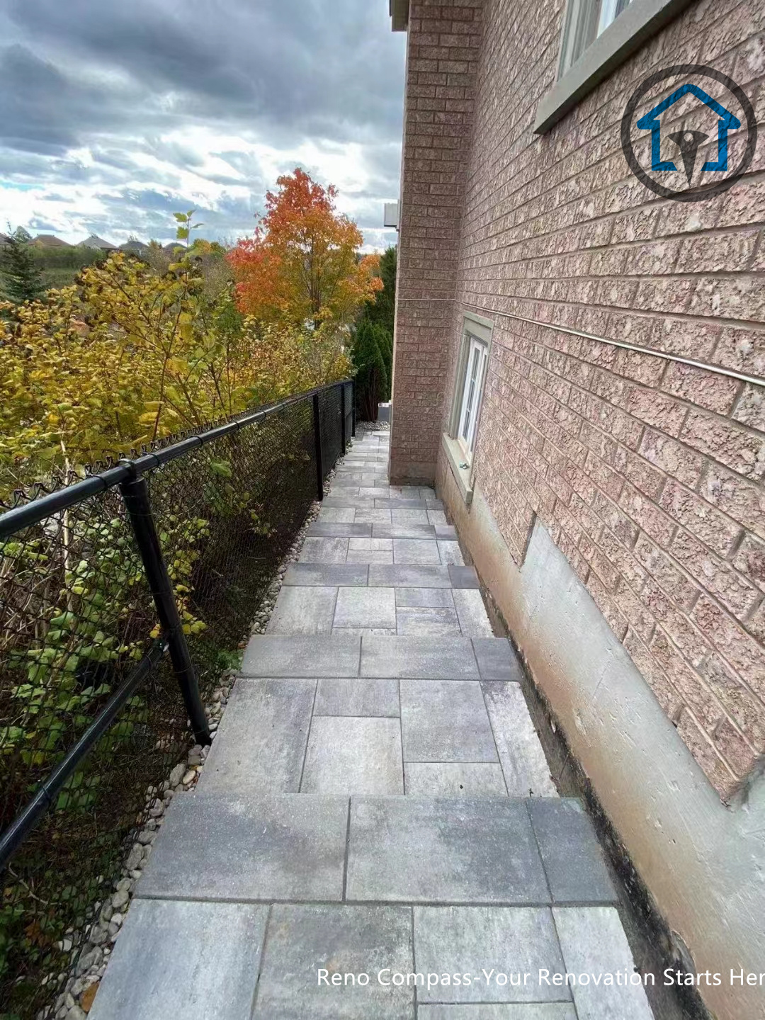 This photo displays the interlocking pattern and edge detailing of a driveway paving project in Oakville. The structured layout enhances visual depth while providing strong load-bearing performance. A professionally installed driveway renovation completed by Reno Compass Inc.